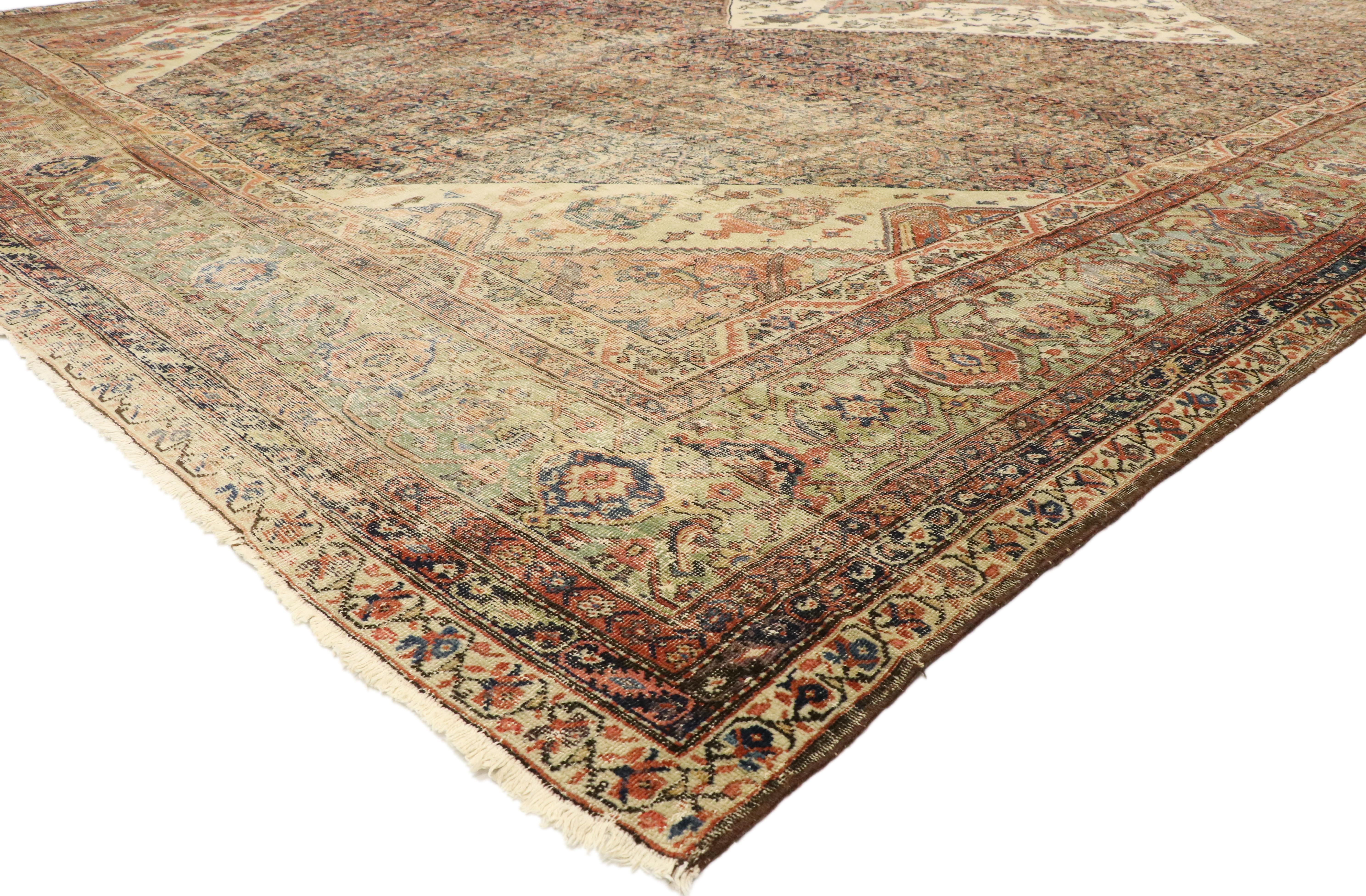 77471, distressed antique Persian Sultanabad Palace rug Modern rustic Industrial style. Down-to-earth vibes and rustic sensibility meet modern Industrial style in this hand knotted wool antique Persian Sultanabad palace rug. Taking center stage is a