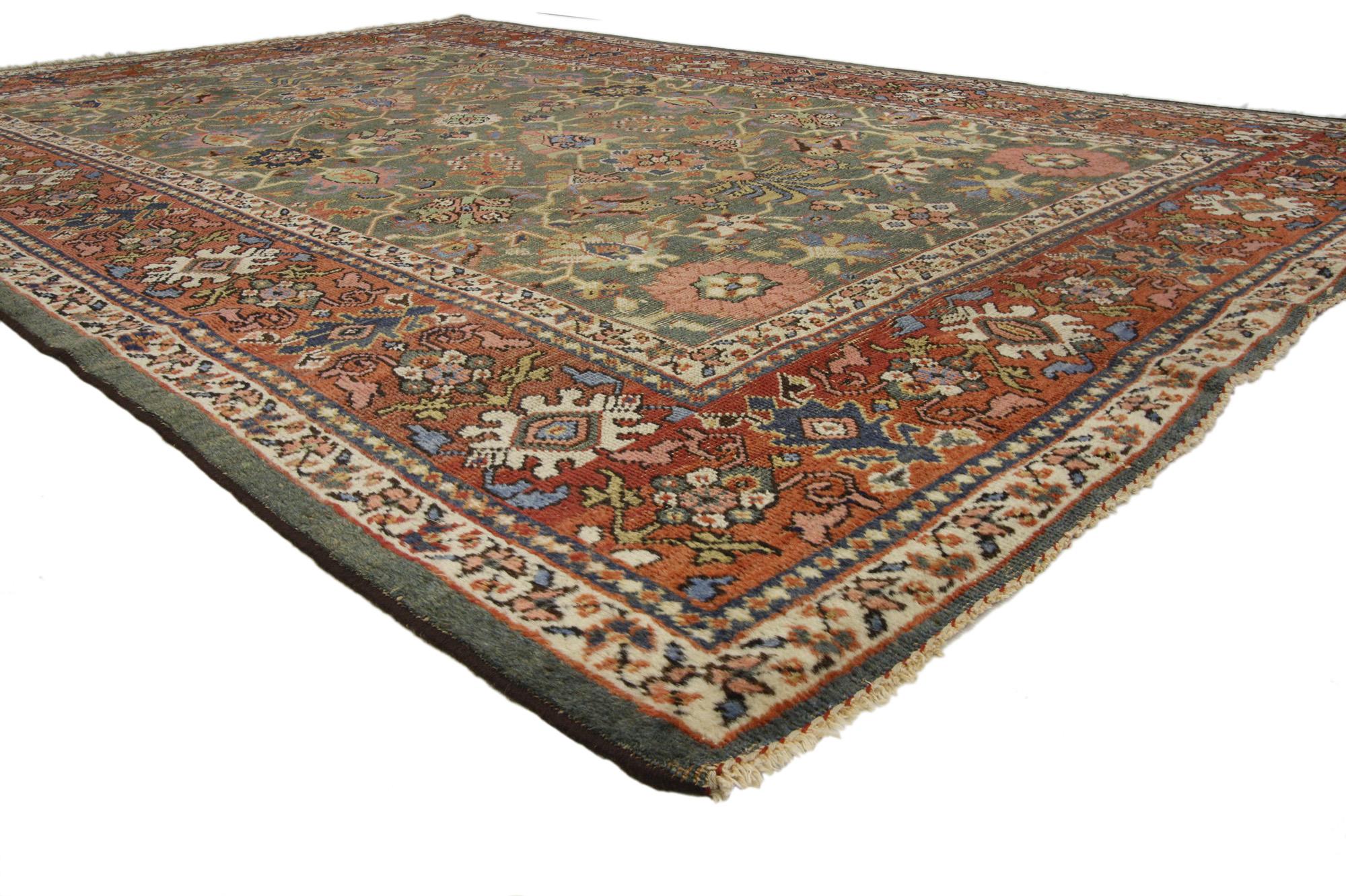 73173 distressed antique Persian Sultanabad rug with Rustic Arts and Crafts style 06'10 x 10'10. Displaying a timeless design and earthy colors combined with cozy simplicity, this hand-knotted wool distressed antique Persian Sultanabad rug