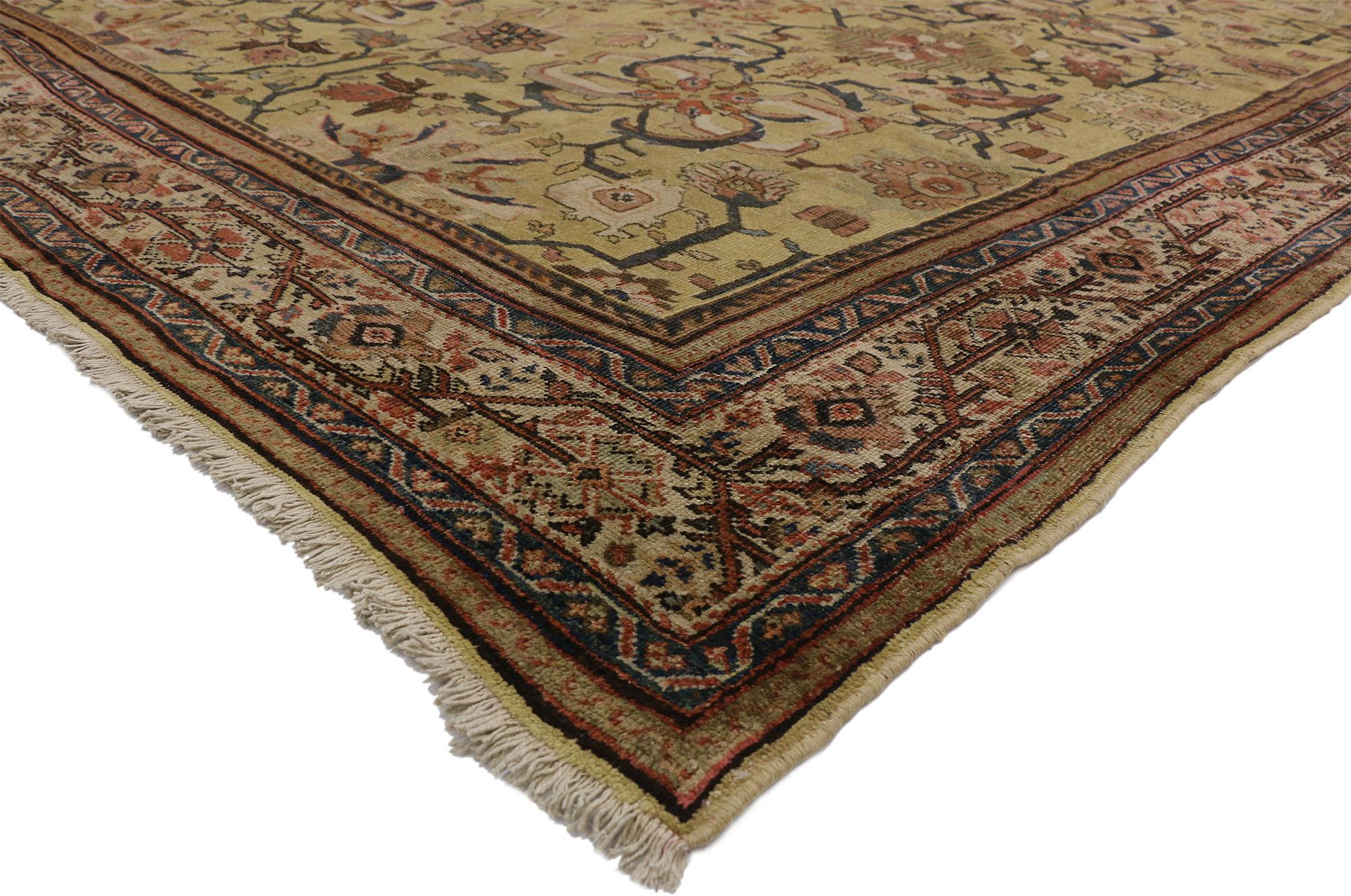 73833 Late 19th Century Distressed Antique Persian Sultanabad rug with Warm Tuscan Italian style 10'06 x 13'06. With its timeless design and warm earthy hues, this hand-knotted wool distressed antique Persian Sultanabad rug beautifully embodies a