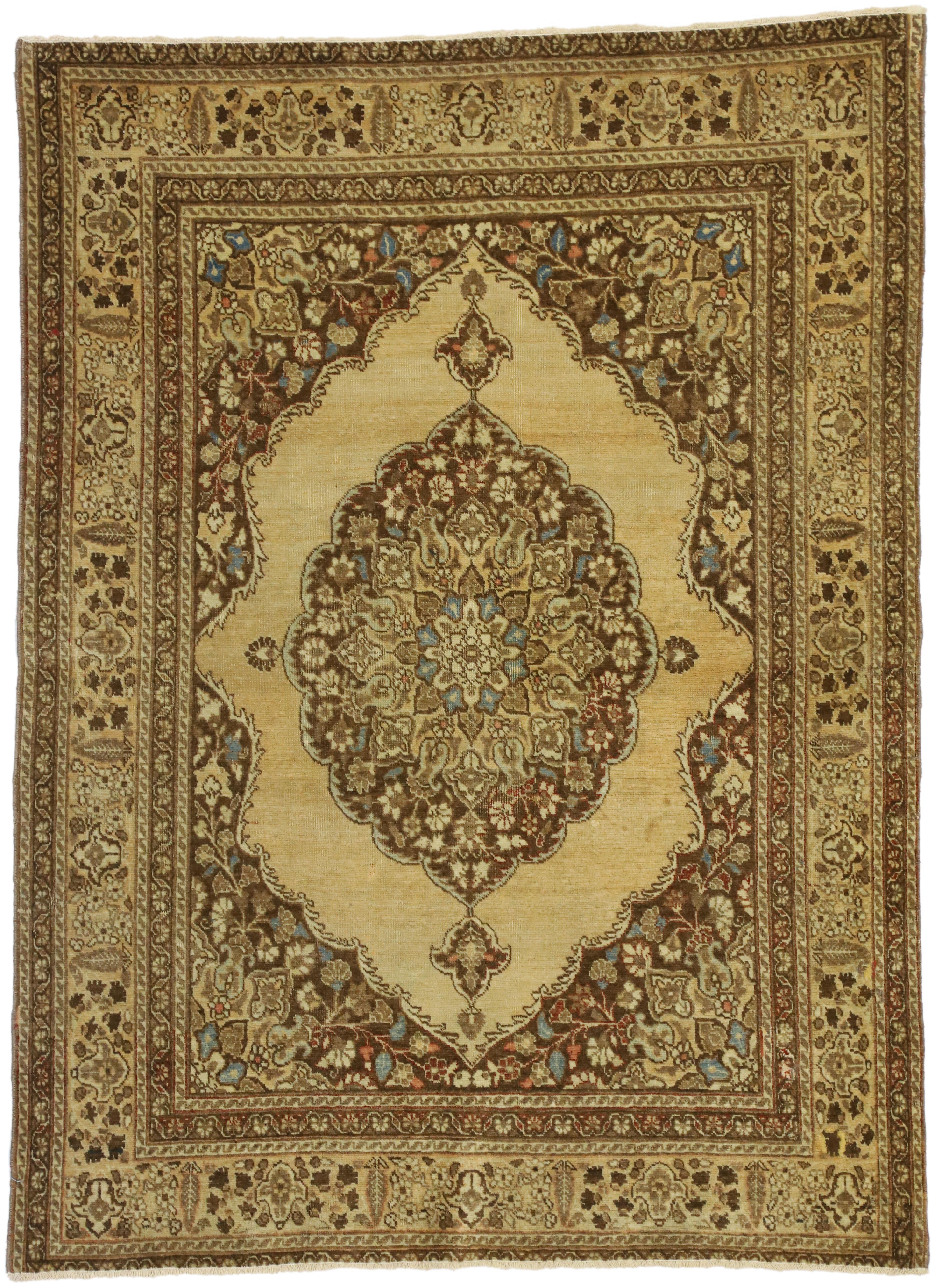 50671 Distressed Antique Persian Tabriz Accent Rug with Rustic Artisan Style 04'00 x 05'04. This hand-knotted wool distressed antique Persian Tabriz rug features a rustic artisan style in warm, neutral colors. Taking center stage, a large medallion