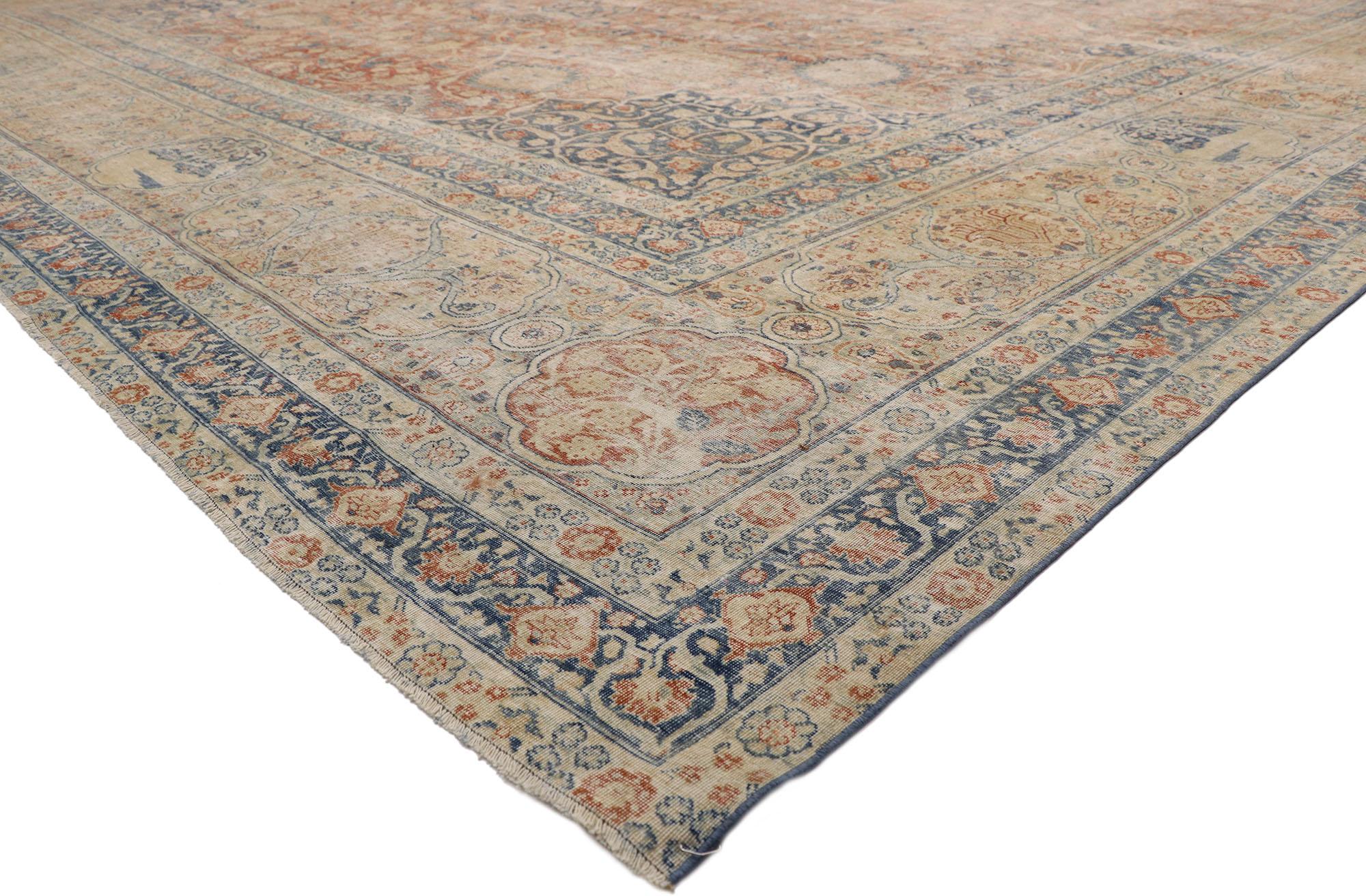 76692 Distressed Antique Persian Tabriz Palace Rug with Rustic Relaxed Federal Style and The Ardabil Carpet Design 15'00 x 21'08. Balancing a timeless floral design with traditional sensibility and a lovingly timeworn patina, this hand-knotted wool