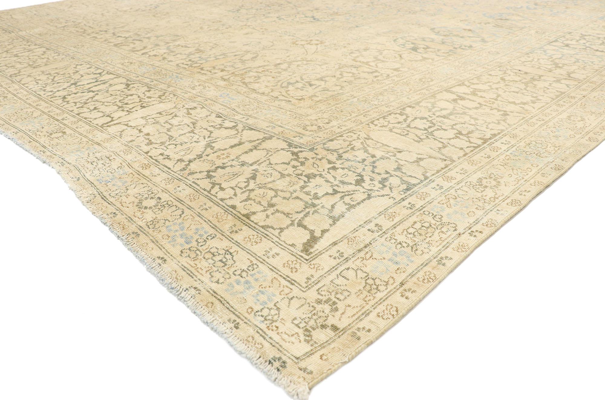 76607 Distressed Antique Persian Tabriz Rug, 11'02 x 13'05.
Cozy Cotswolds meets rustic luxe in this hand knotted wool distressed antique Persian Tabriz rug. The visual intricacy and muted earth-tone colors woven into this piece work together