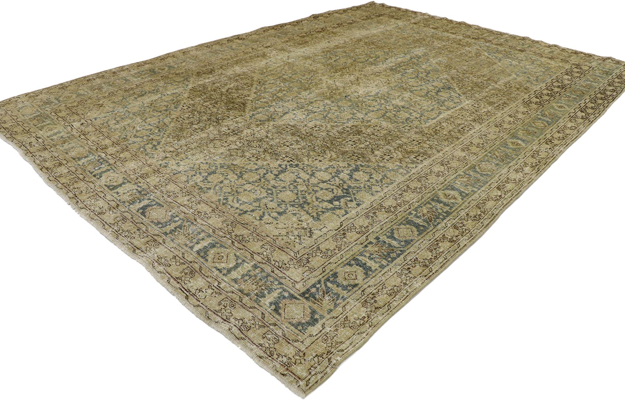 53222, distressed antique Persian Tabriz rug with modern industrial style. Warm and inviting with rustic sensibility, this hand knotted wool distressed antique Persian Tabriz rug beautifully embodies a Modern Industrial style. The lovingly time-worn