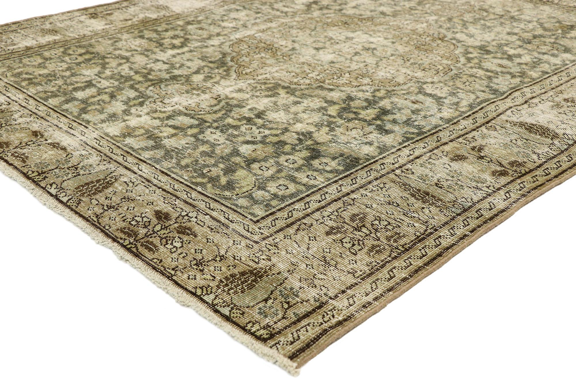 51531, distressed antique Persian Tabriz rug with Modern Industrial style. With the harmony of an extremely mature and subdued color palette of color and lovingly time-worn composition, this hand knotted wool distressed antique Persian Tabriz rug