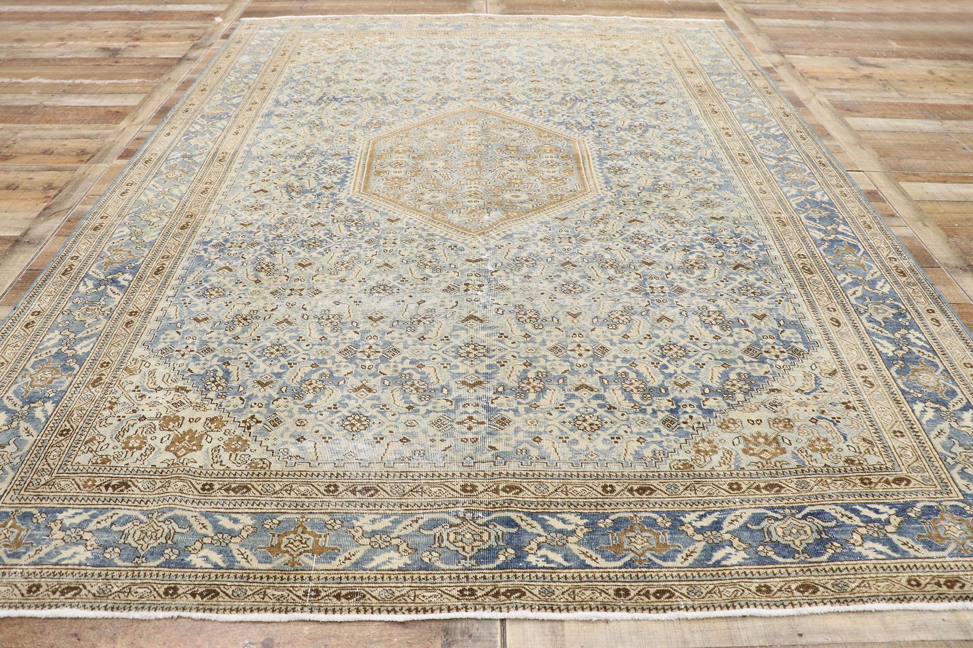Wool Distressed Antique Persian Tabriz Rug with Rustic Coastal Style For Sale