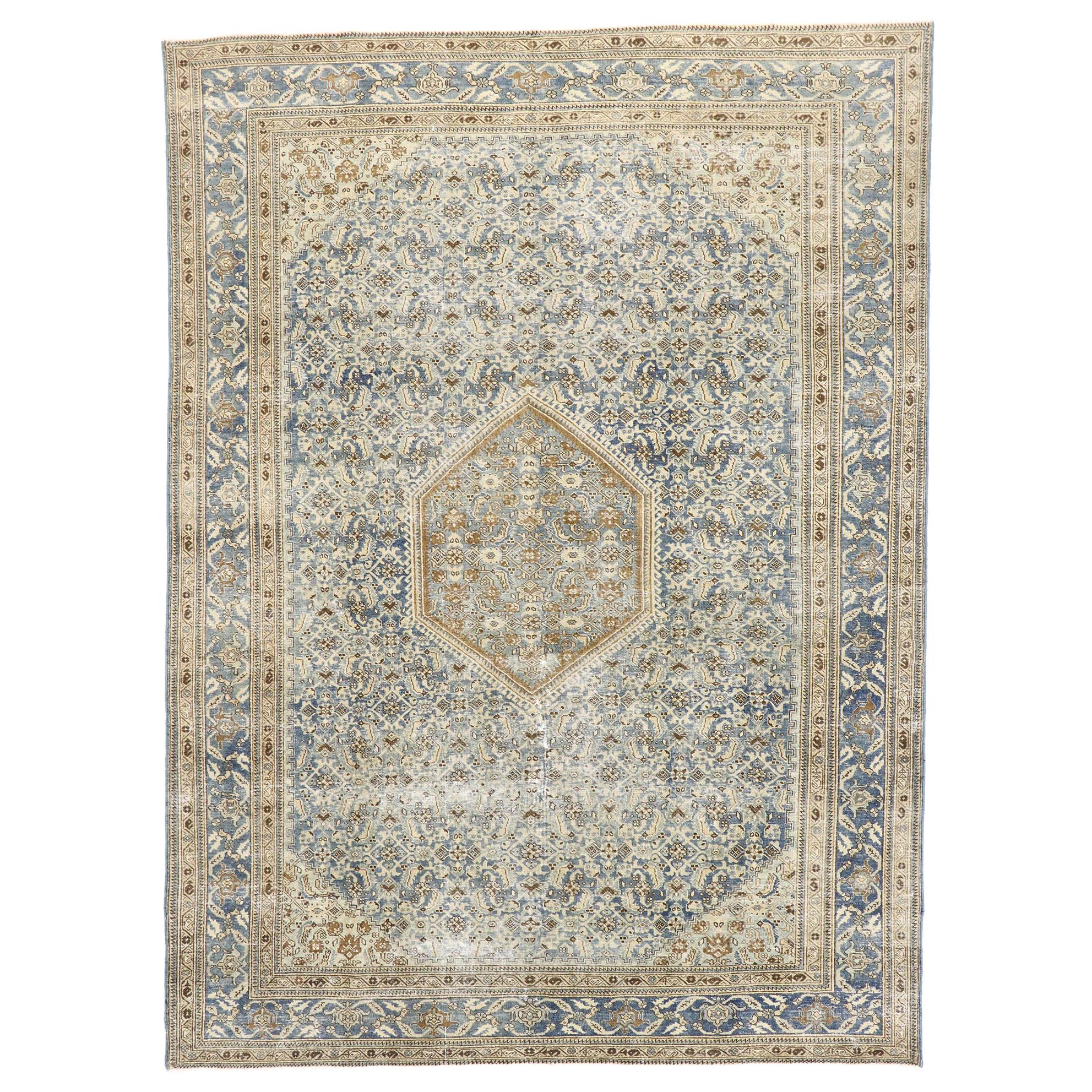 Distressed Antique Persian Tabriz Rug with Rustic Coastal Style For Sale