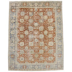 Distressed Antique Persian Tabriz Rug with Rustic Colonial Style