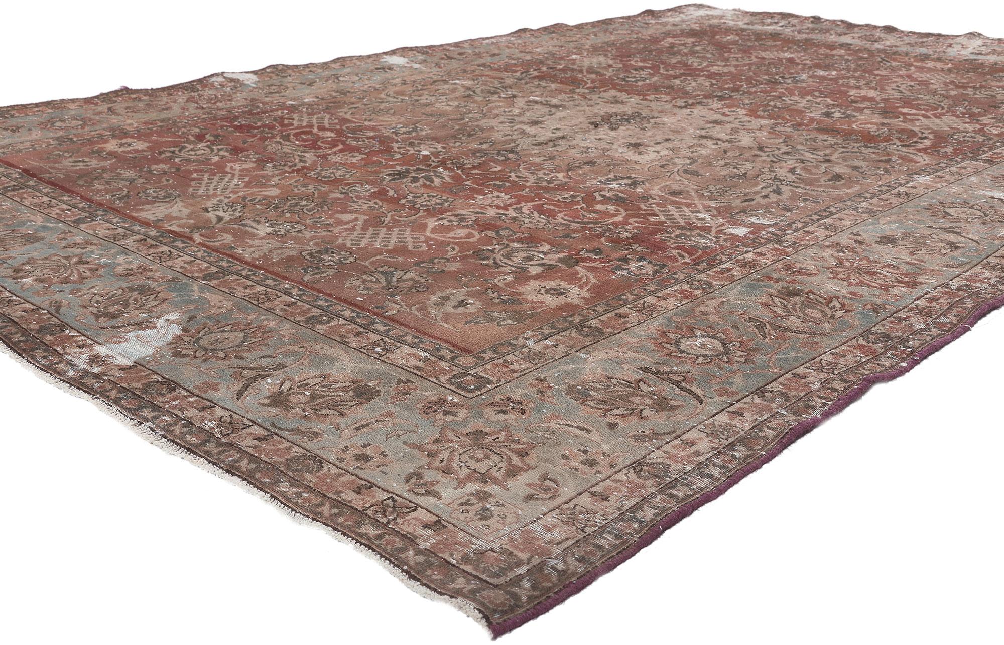 78599 Distressed Antique Persian Tabriz Rug, 06'05 x 09'08.
Rustic elegance meets unpretentious and simple in this distressed vintage Persian Tabriz rug. The botanical design and earthy colorway woven into this piece work together creating a rustic