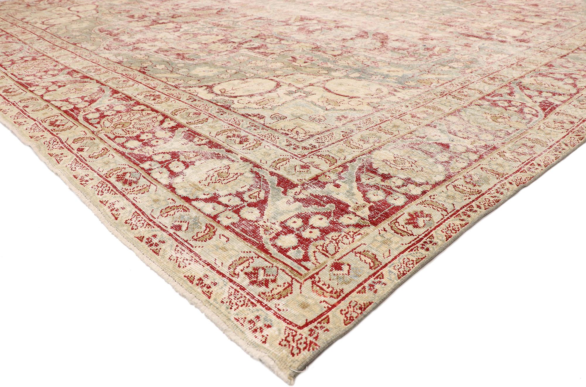 77076, distressed antique Persian Tabriz rug with rustic English chintz style 11'11 x 14'09. Balancing a timeless floral design with traditional sensibility and a lovingly timeworn patina, this hand knotted wool distressed antique Persian Tabriz rug