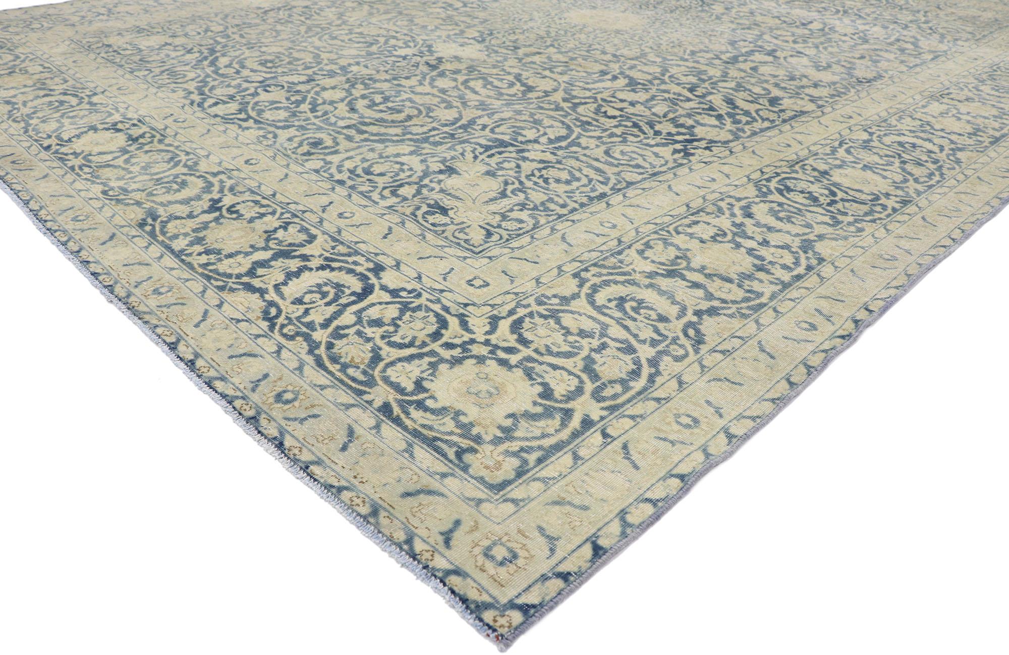60869 distressed antique Persian Tabriz rug with rustic Greek Mediterranean style. Emanating coastal vibes with light and airy colors, this hand-knotted wool distressed antique Persian Tabriz rug is a captivating vision of woven beauty. Taking