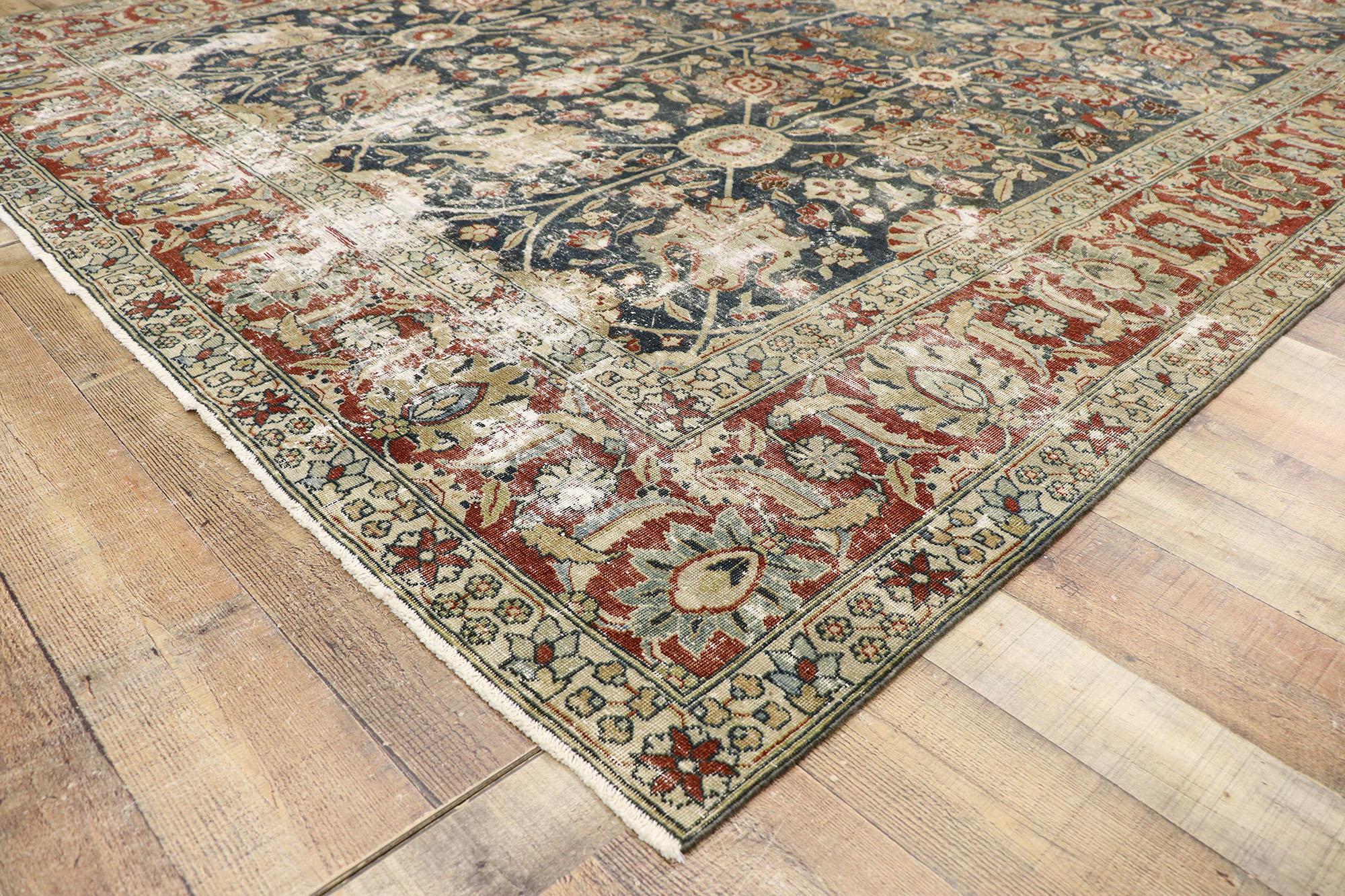 Wool Distressed Antique Persian Tabriz Rug with Rustic Old World English Style For Sale