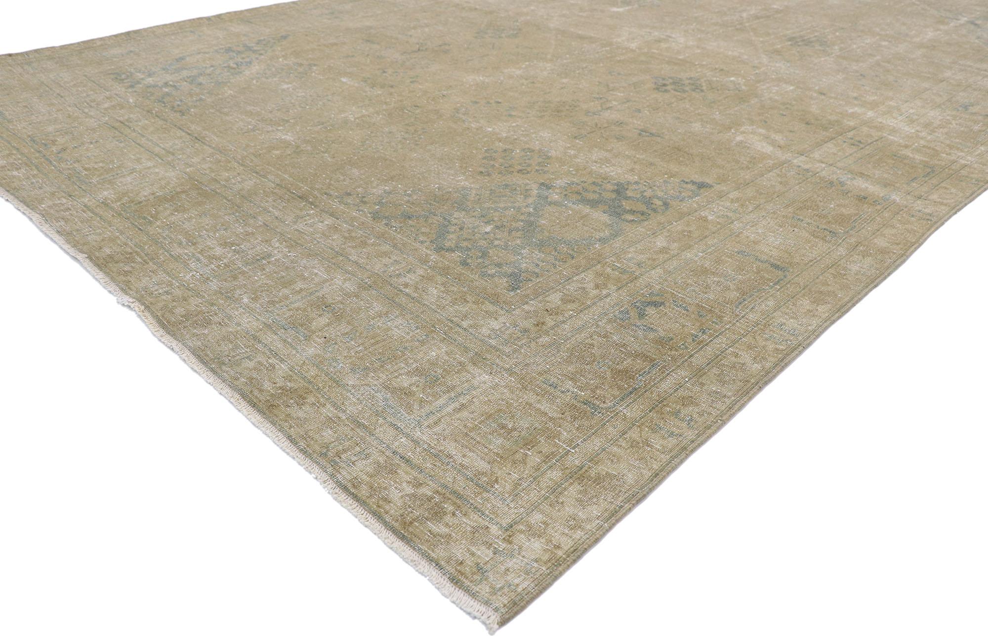 60854 Distressed Antique Persian Tabriz rug with Rustic Plantation style. Emanating sophistication and grace with light neutral colors, this hand knotted wool distressed antique Persian Tabriz rug beautifully embodies a rustic Plantation style. The