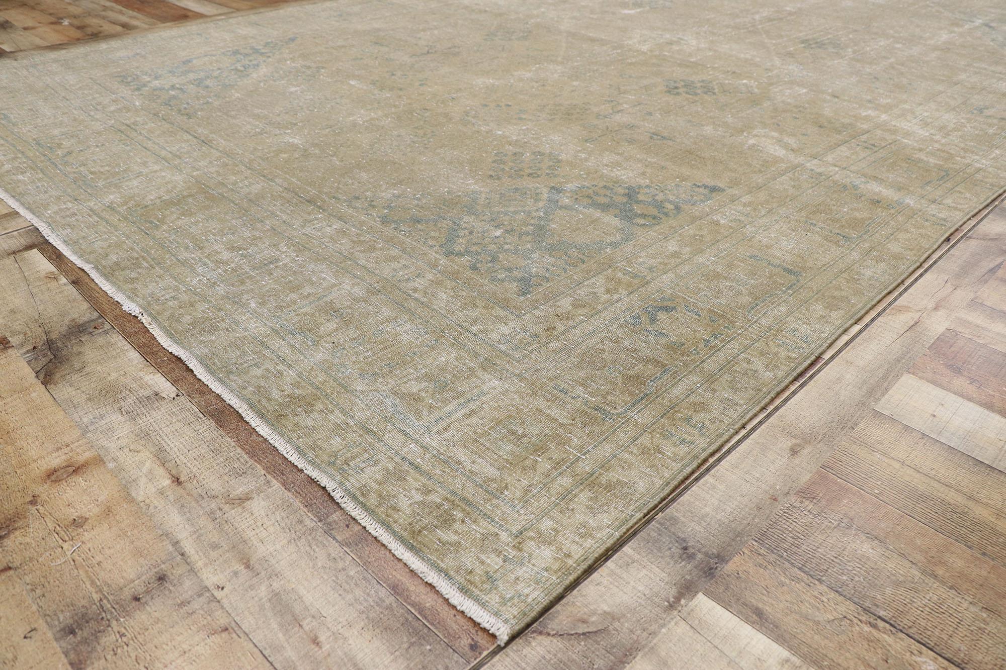 20th Century Distressed Antique Persian Tabriz Rug with Rustic Plantation Style For Sale