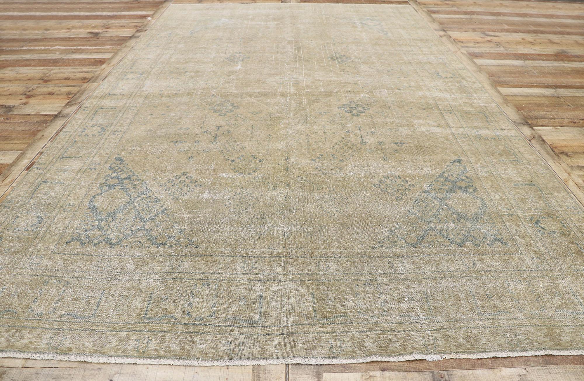 Wool Distressed Antique Persian Tabriz Rug with Rustic Plantation Style For Sale
