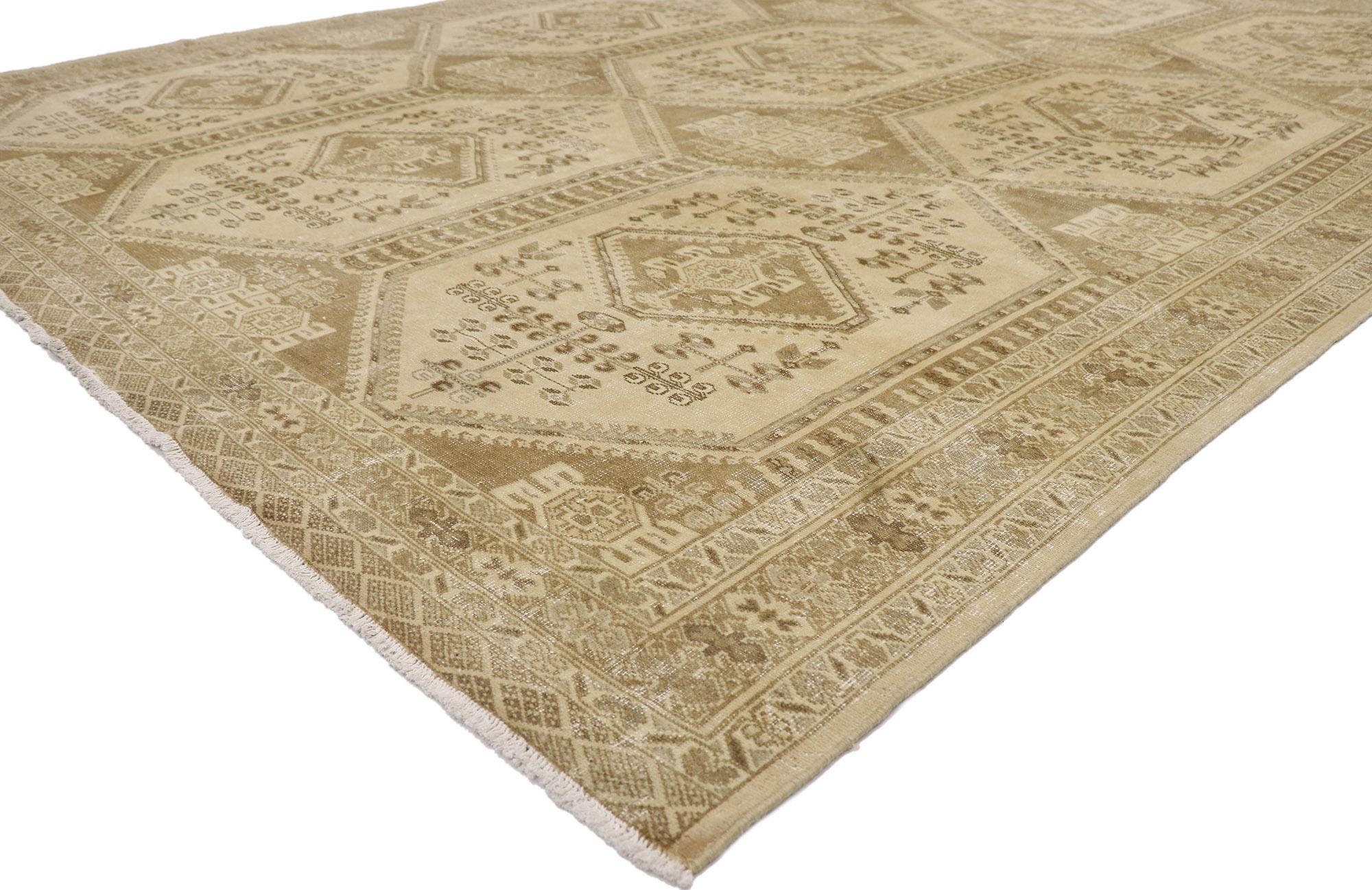 60938 Distressed Antique Persian Turkaman rug with Modern Rustic Style 09'09 x 12'04. Emanating sophistication and nomadic charm with rustic sensibility, this hand knotted wool distressed antique Persian Turkaman rug beautifully embodies a modern