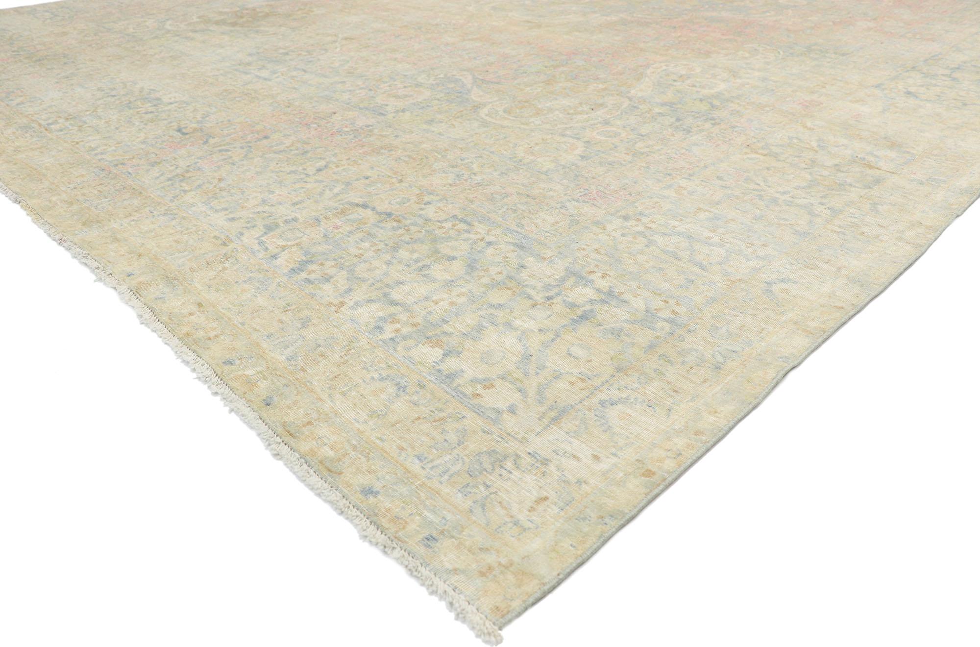 76889 Distressed Antique Persian Yazd Rug with Cotswold Country Cottage Style 10'04 x 15'09. With a timeless floral design and lovingly timeworn appearance, this hand knotted wool distressed antique Persian Yazd rug charms with ease and beautifully
