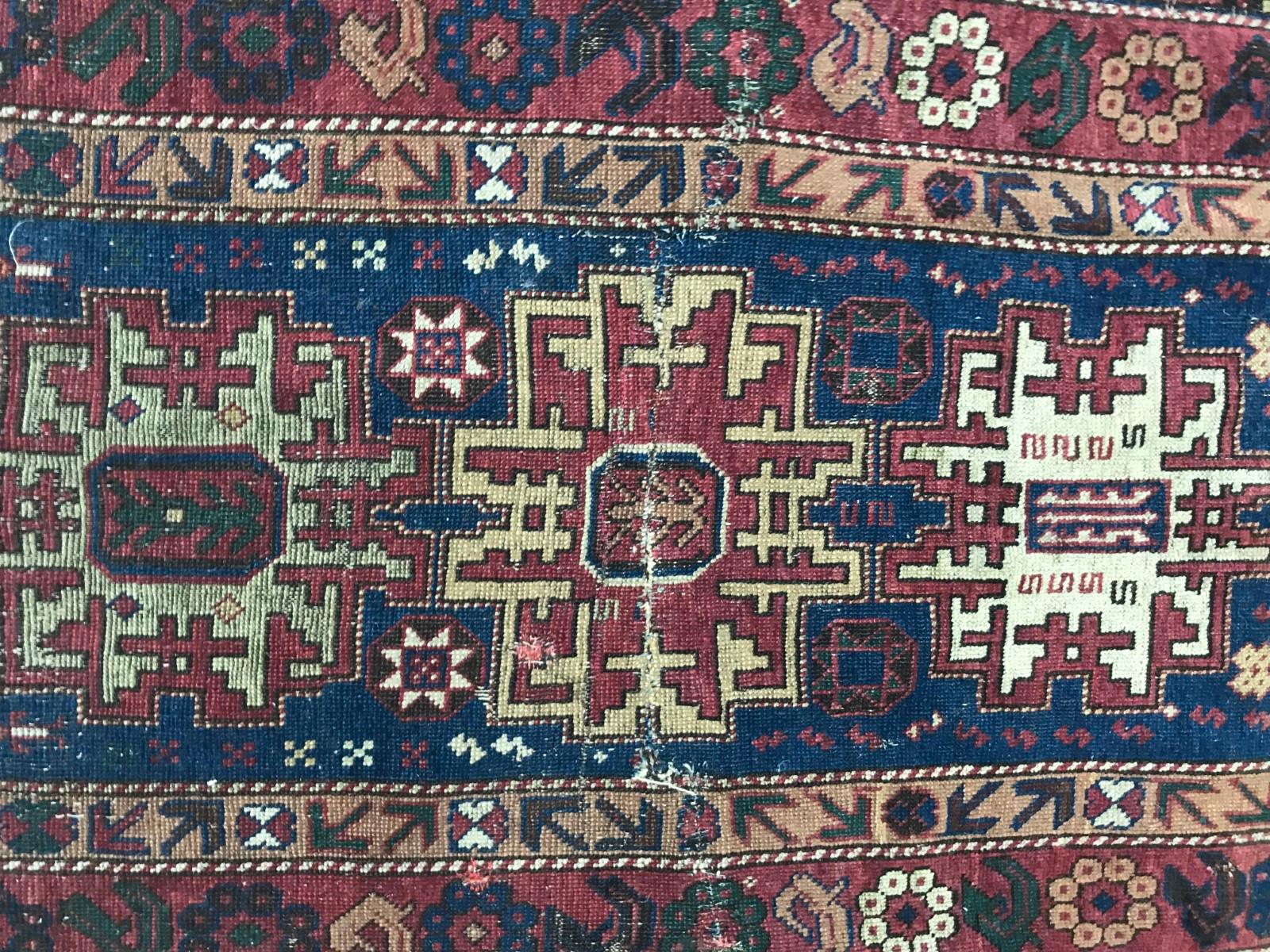 Late 19th century Caucasian Shirwan rug with natural colors with blue, orange, yellow, purple and green, and a lesgui geometrical design, entirely hand knotted with wool velvet on wool foundation.