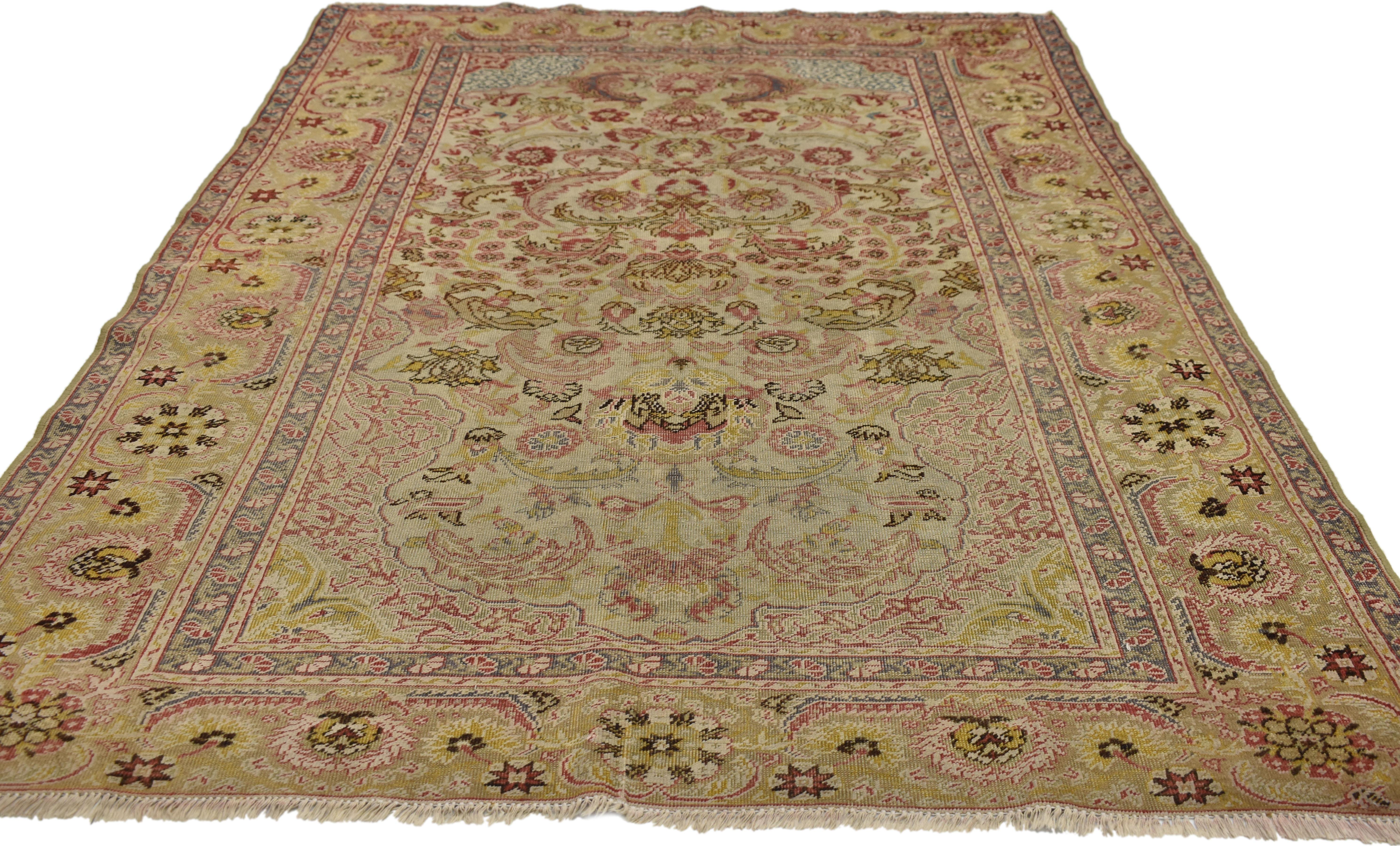 Arts and Crafts Distressed Antique Turkish Hereke Rug with Rustic English Country Cottage Style