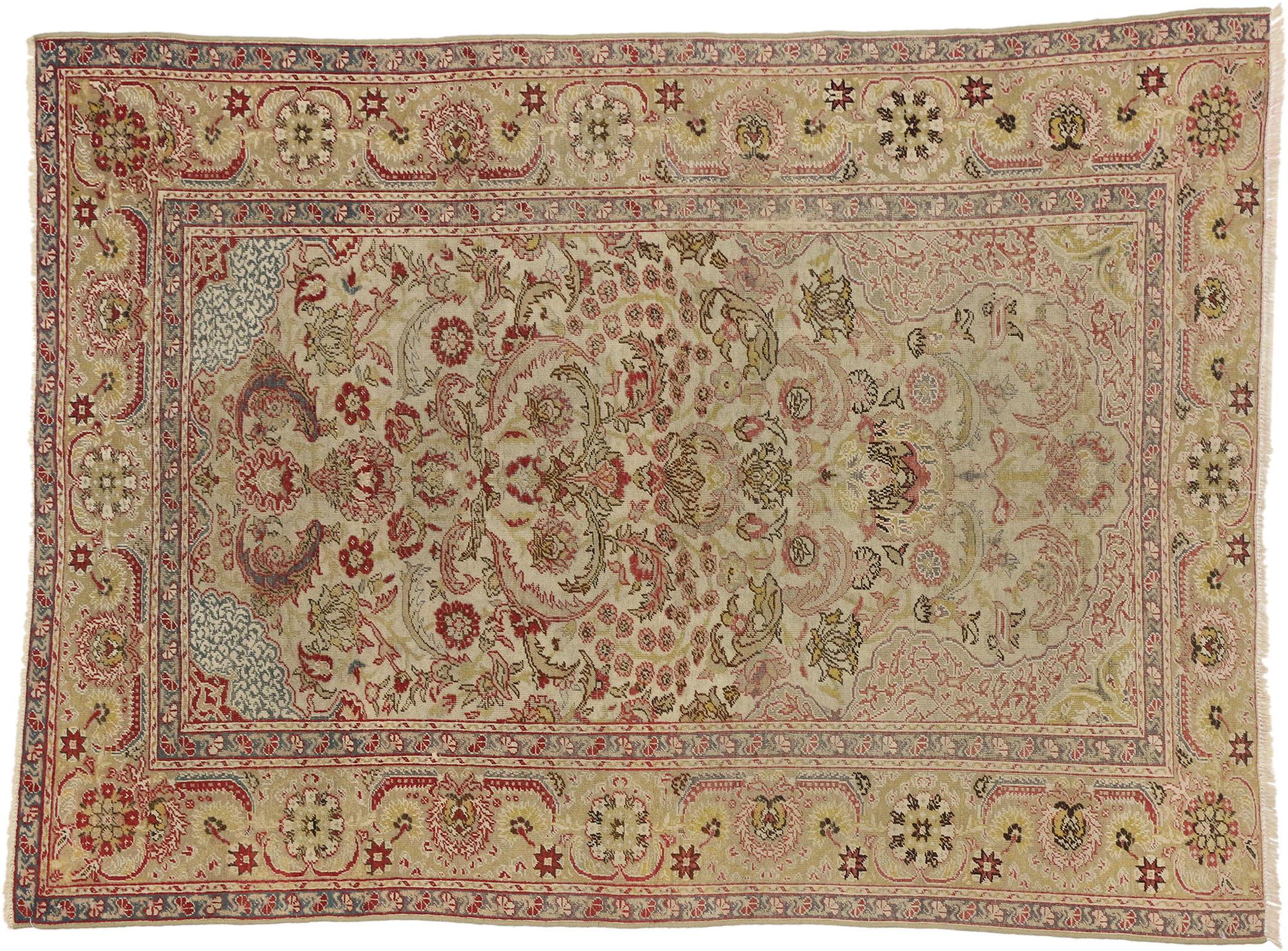 Distressed Antique Turkish Hereke Rug with Rustic English Country Cottage Style In Distressed Condition In Dallas, TX