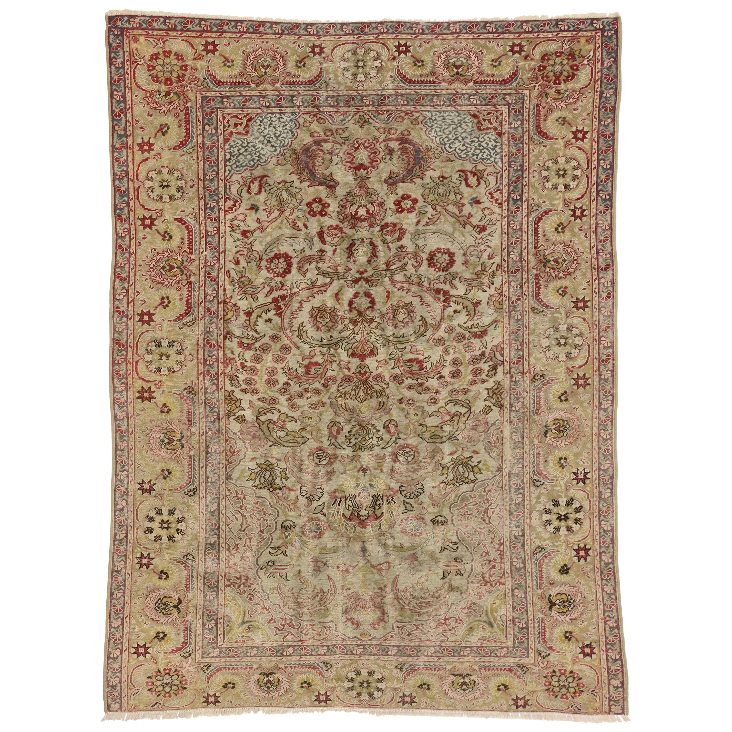 Distressed Antique Turkish Hereke Rug with Rustic English Country Cottage Style