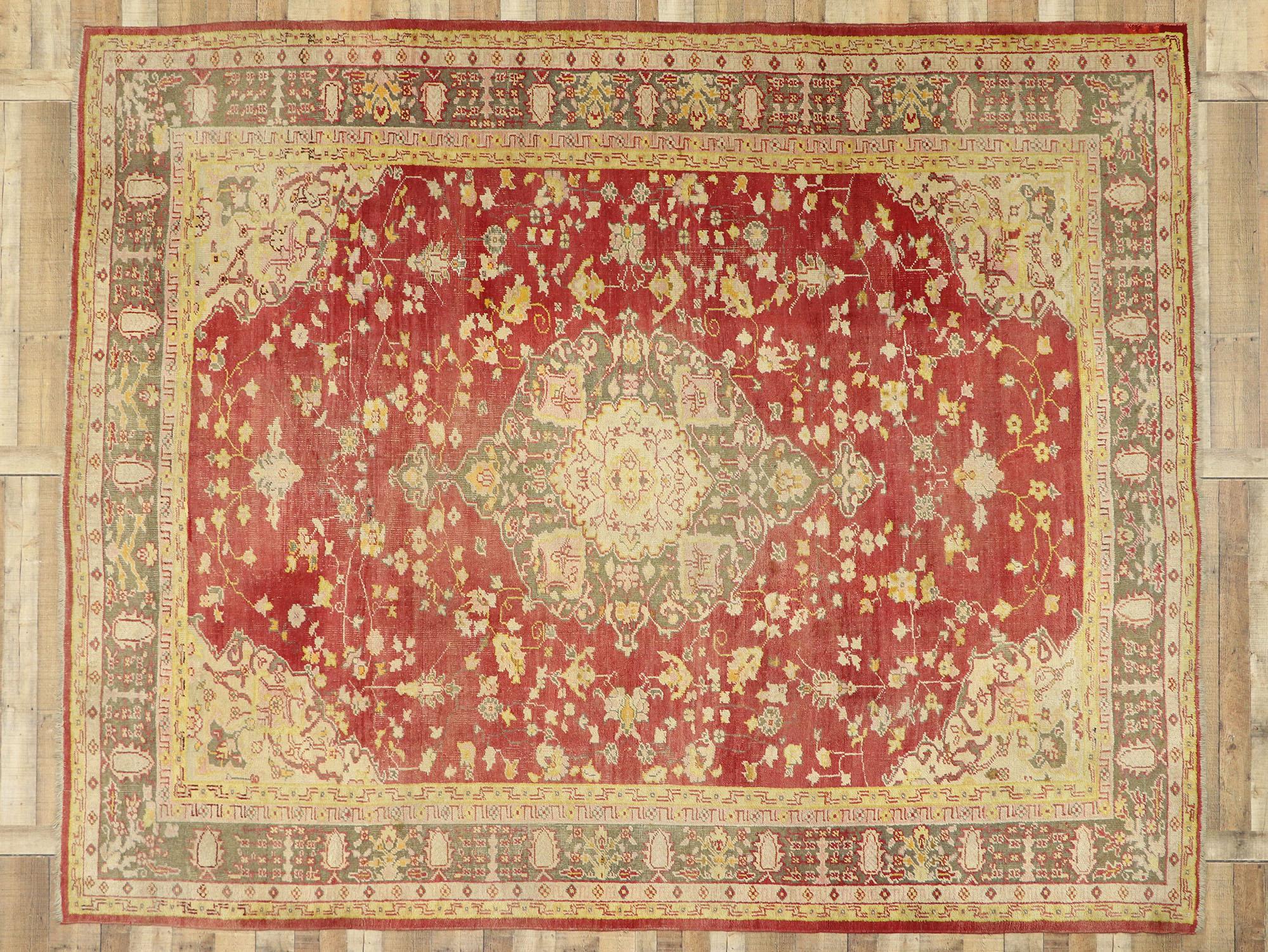 76787 Distressed Antique Turkish Oushak Area Rug with Rustic Arts & Crafts Style. This hand-knotted wool distressed antique Turkish Oushak features a cusped centre medallion flanked with palmette finials. The central medallion is surrounded by a