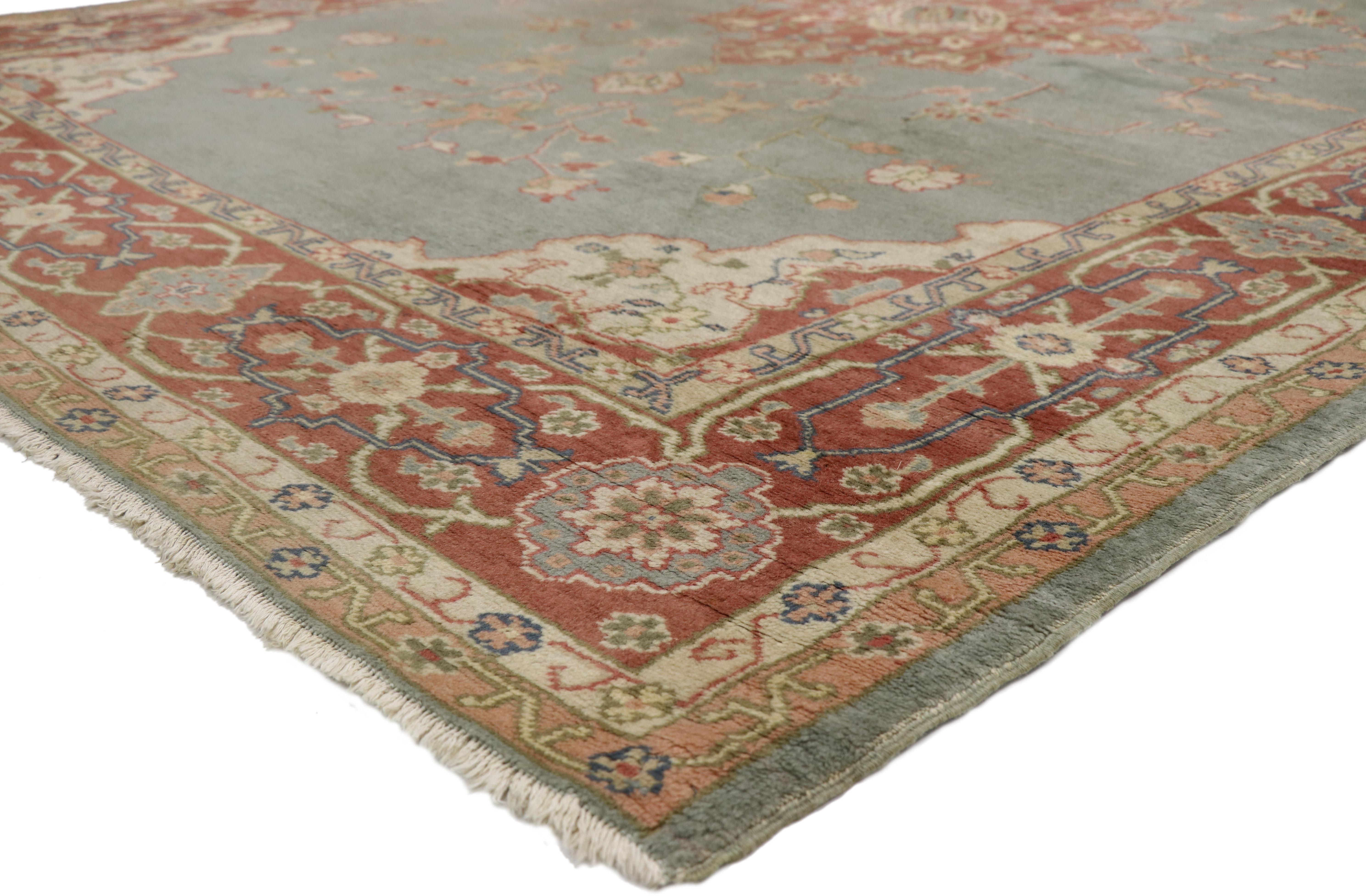 77357, distressed antique Turkish Oushak rug with rustic Georgian and Arts & Crafts style. A beautiful combination of warm terracotta tones and soft bluish-grey hues, this hand knotted wool distressed antique Turkish Oushak rug creates a delicate
