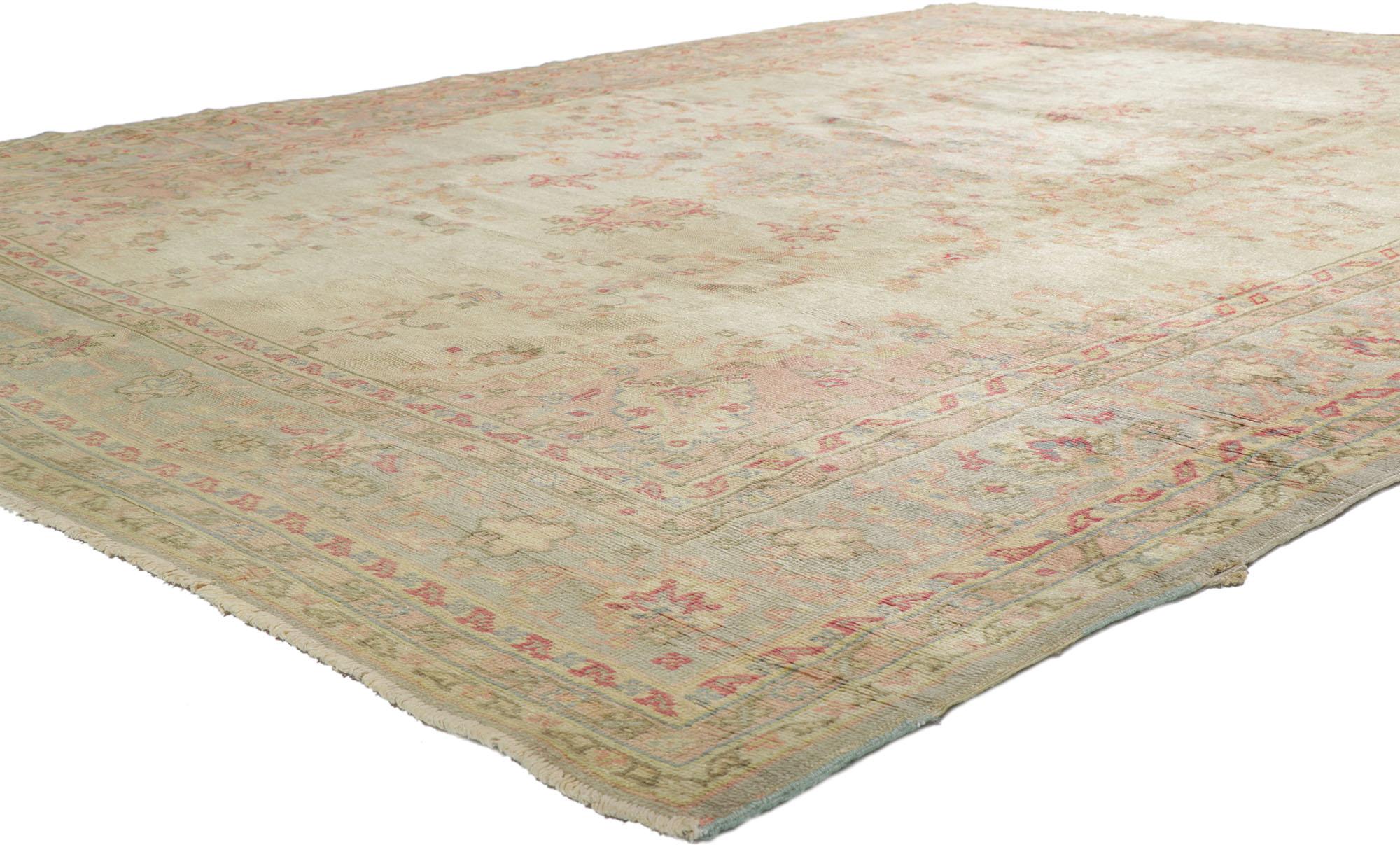 71741 distressed antique Turkish Oushak rug with Rustic Georgian style. With its warm pastel colors and architectural elements of naturalistic forms with a lovingly time-worn aesthetic, this hand-knotted wool antique Turkish Oushak rug beautifully