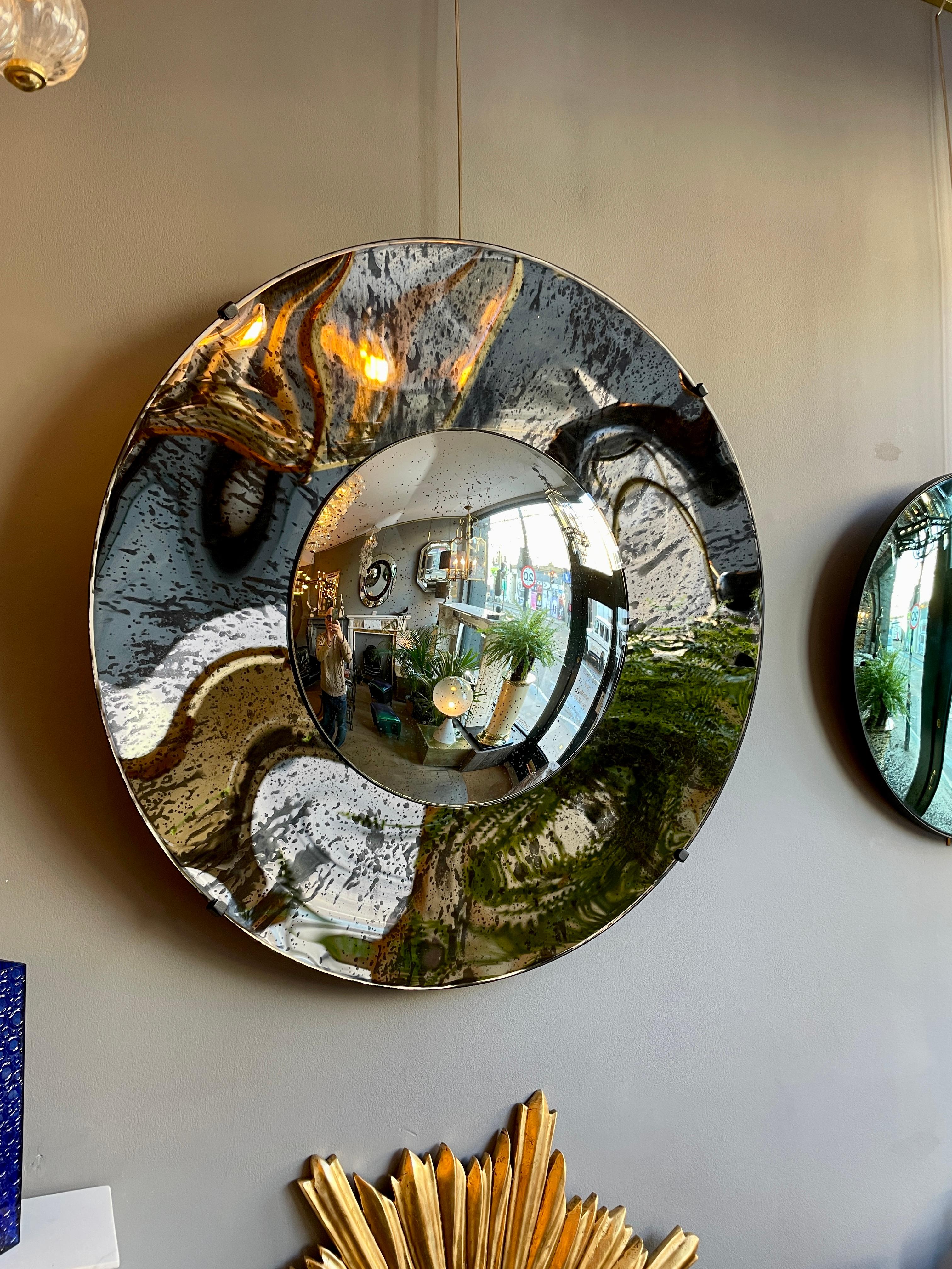 European Distressed Bronze and Silver Concave Mirror For Sale