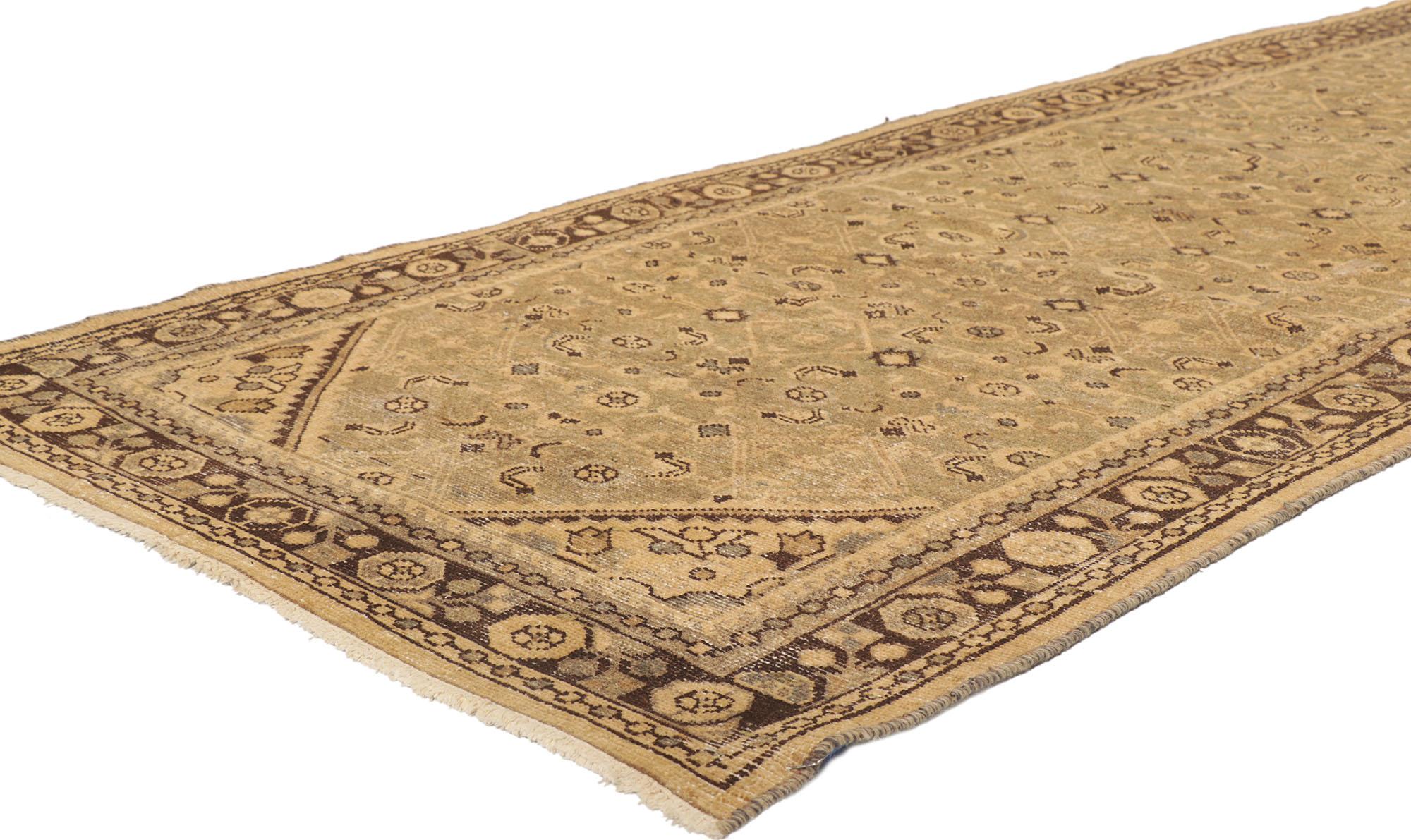 53753 Distressed brown Antique Persian Malayer runner 03'07 x 10'00. The abrashed brown field features an all-over Herati pattern. The Classic Herati design, also known as the Mahi or Fish pattern, is amongst the most widespread and well known of