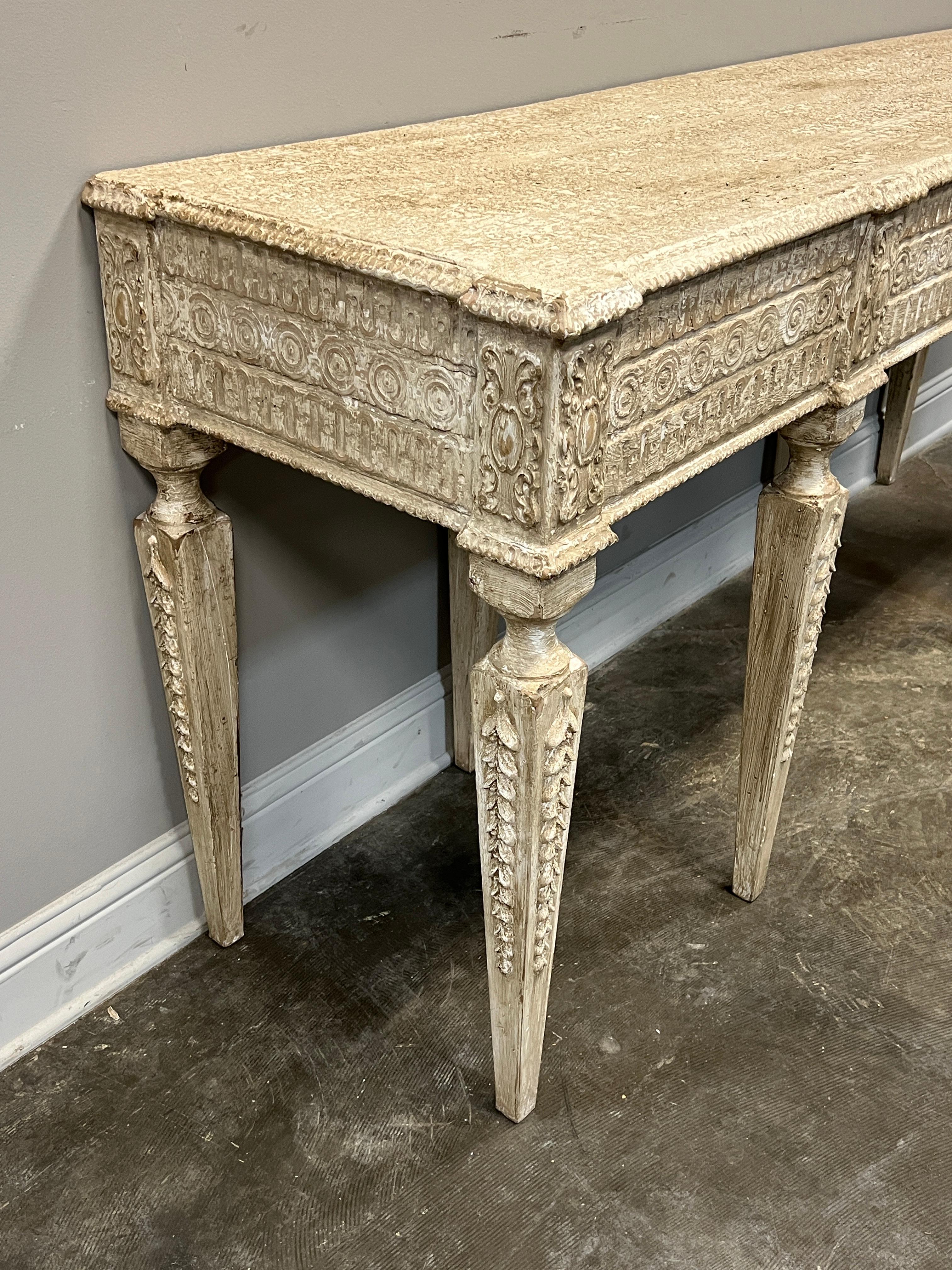 Beautifully realized Italian Renaissance Style Console with very well done distressed finish over detailed hand carved frontispiece.
