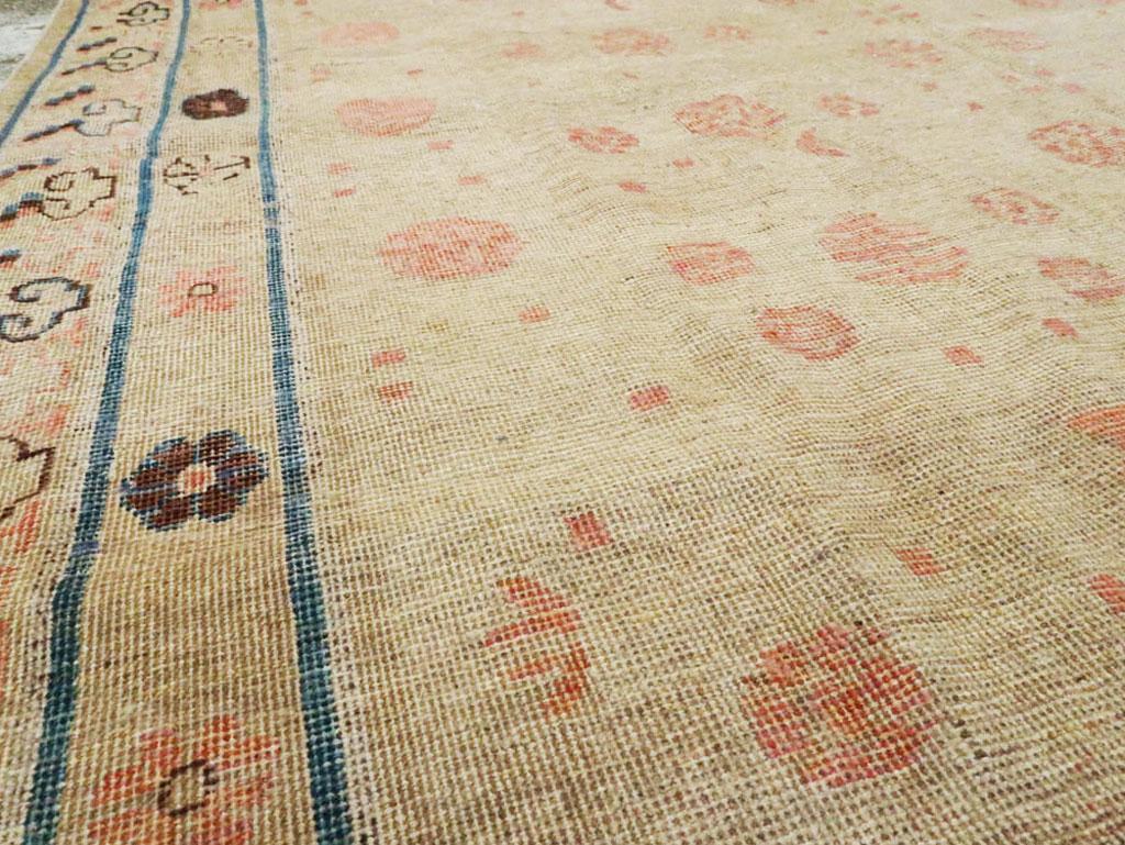 Distressed East Turkestan Khotan Gallery Carpet in Beige, Pink and Blue In Good Condition In New York, NY