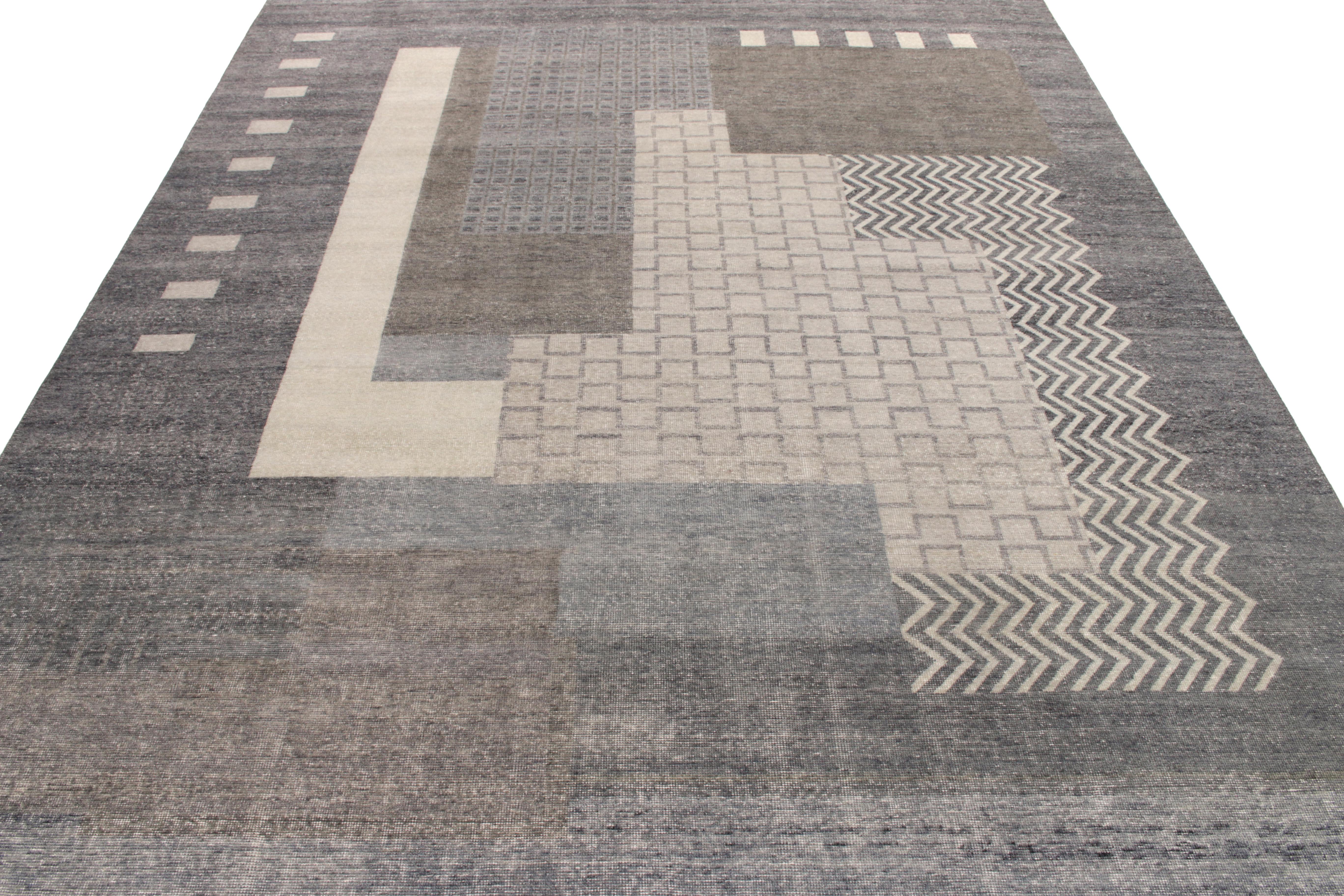 From Rug & Kilim’s distressed-style Homage Collection, a 10x14 ode to venerated French Art Deco rug styles in cool, industrial colors. Hues of silver and gray play with a mild blue and taupe accent in the geometry, sitting with a sophisticated,