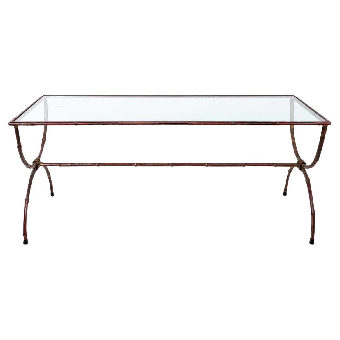 Gilt metal Faux Bamboo and Glass Insert Coffee Table. Distressed gilt finish for a nice warm feel. Marked Italy on underside. Good overall distressed finish, Sturdy and ready to use.