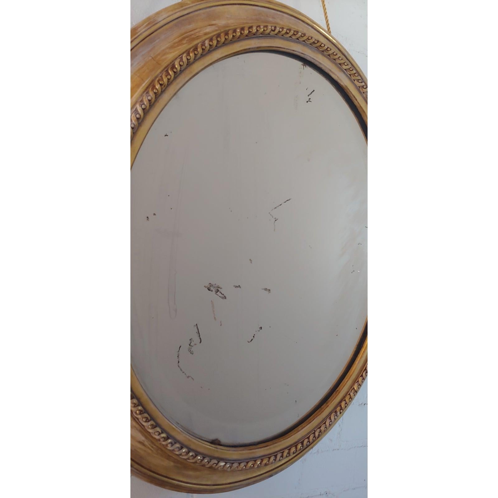 Distressed Gilt Oval Antiqued Mirror Hung by Rope In Good Condition For Sale In Los Angeles, CA