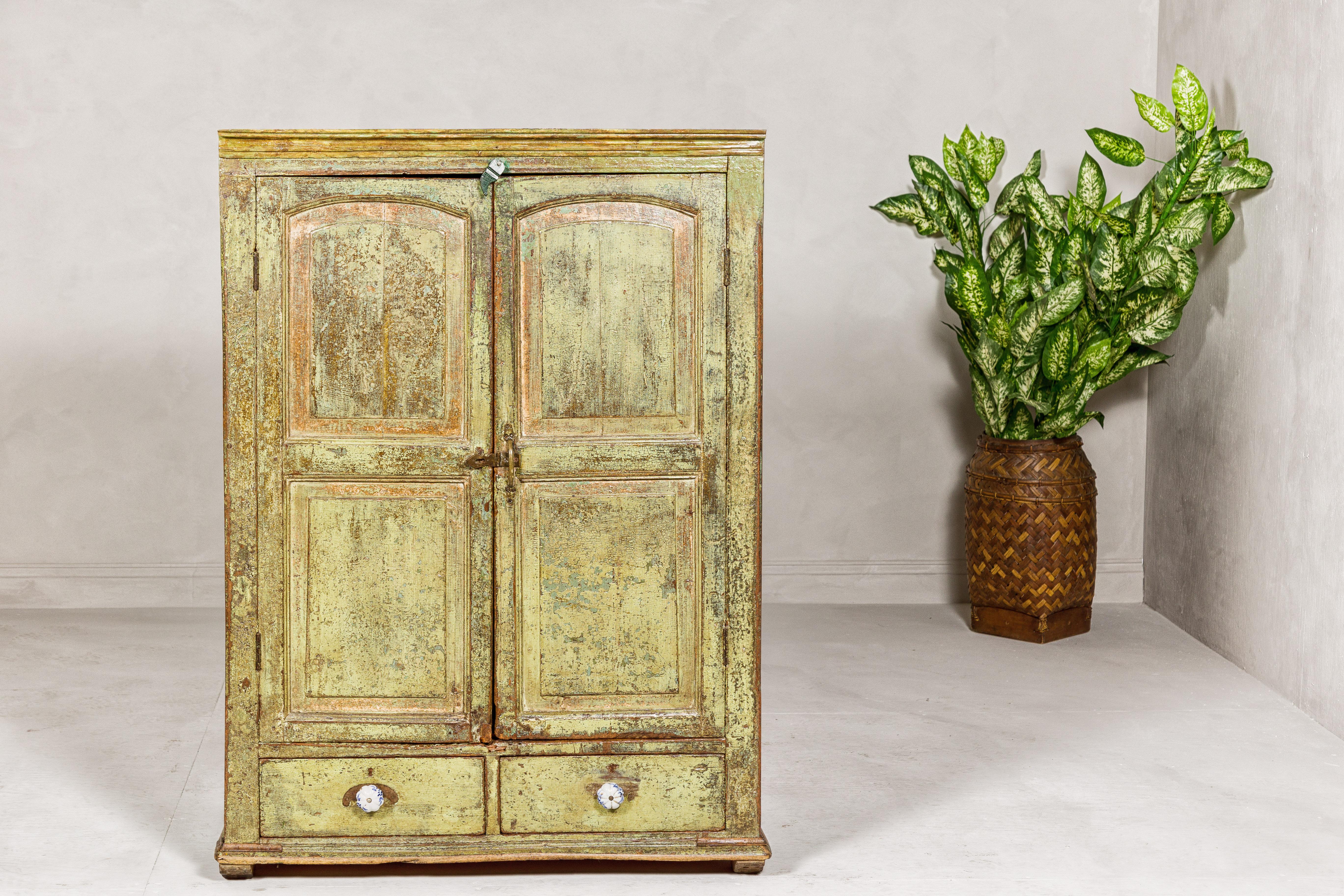 Carved Distressed Green Painted Indian Cabinet with Paneled Doors and Two Drawers For Sale