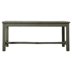 Distressed Green Wooden Bench with Weathered Patina