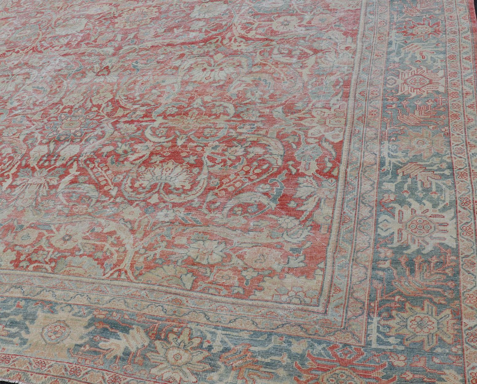 Distressed antique Persian Sultanabad rug in faded colors. Sultanabad Mahal antique rug from Persia with all-over geometric design, Keivan Woven Arts / rug EMB-9558-P13029, country of origin / type: Iran / Mahal, circa 1920s faded red background,