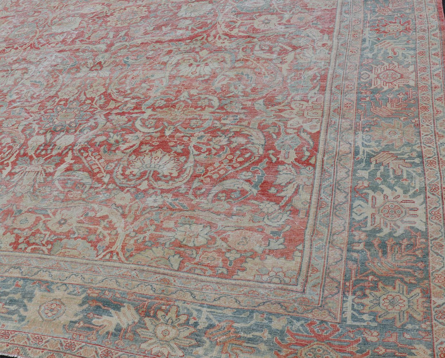 Distressed antique Persian Sultanabad rug in faded colors. Sultanabad Mahal antique rug from Persia with all-over geometric design, Keivan Woven Arts / rug EMB-9558-P13029, country of origin / type: Iran / Mahal, circa 1920s faded red background,