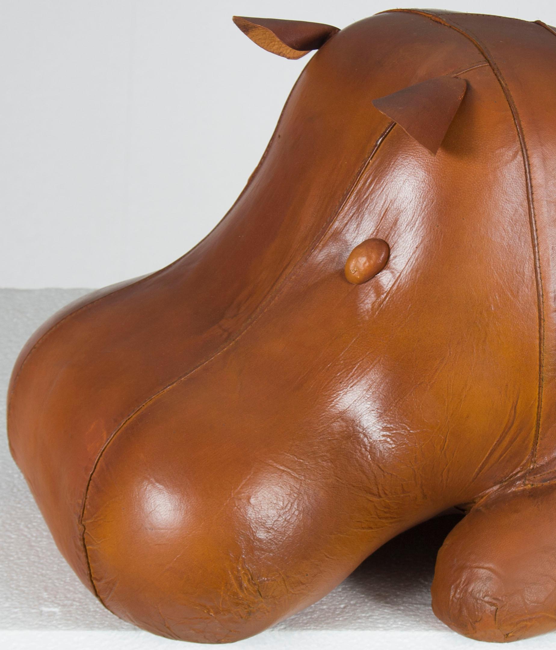 A unique version of our larger model, this incredibly cute laying leather hippo ottoman is made out of beautiful brown leather. It makes a sturdy footstool and beautiful piece of decor for your home. Newly handmade in England, the superb quality is