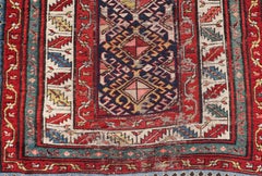 Distressed Medallion Antique Caucasian Kazak Rug with Geometric Medallions
