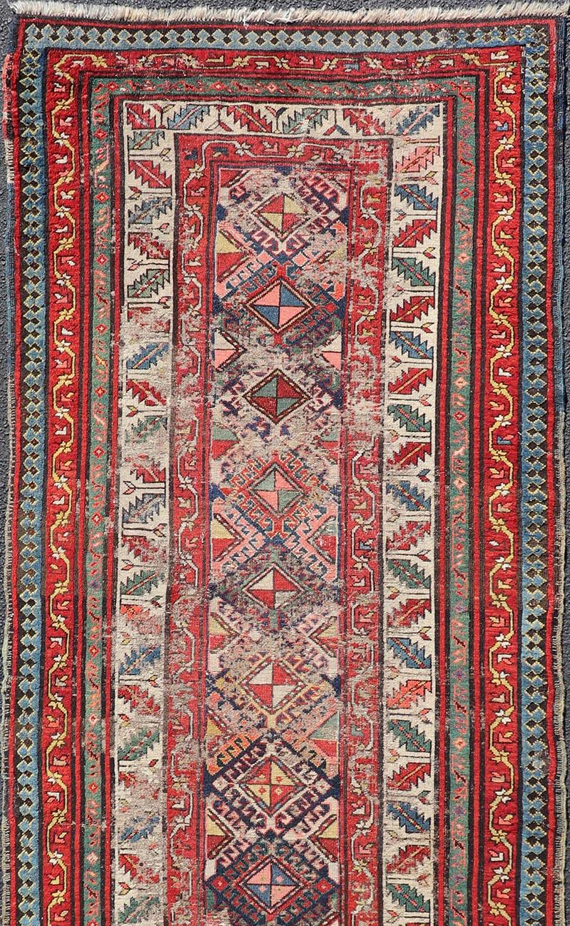 Wool Distressed Medallion Antique Caucasian Kazak Rug with Geometric Medallions For Sale