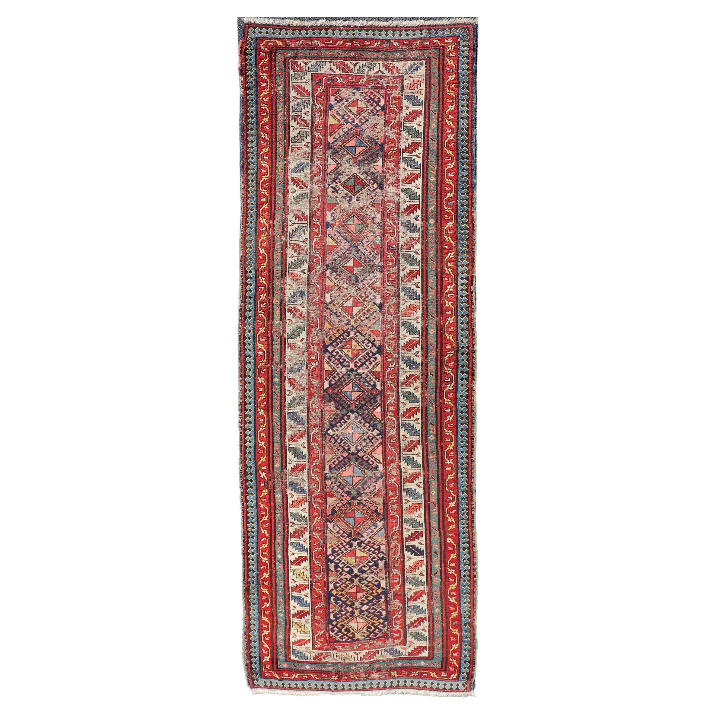 Distressed Medallion Antique Caucasian Kazak Rug with Geometric Medallions For Sale