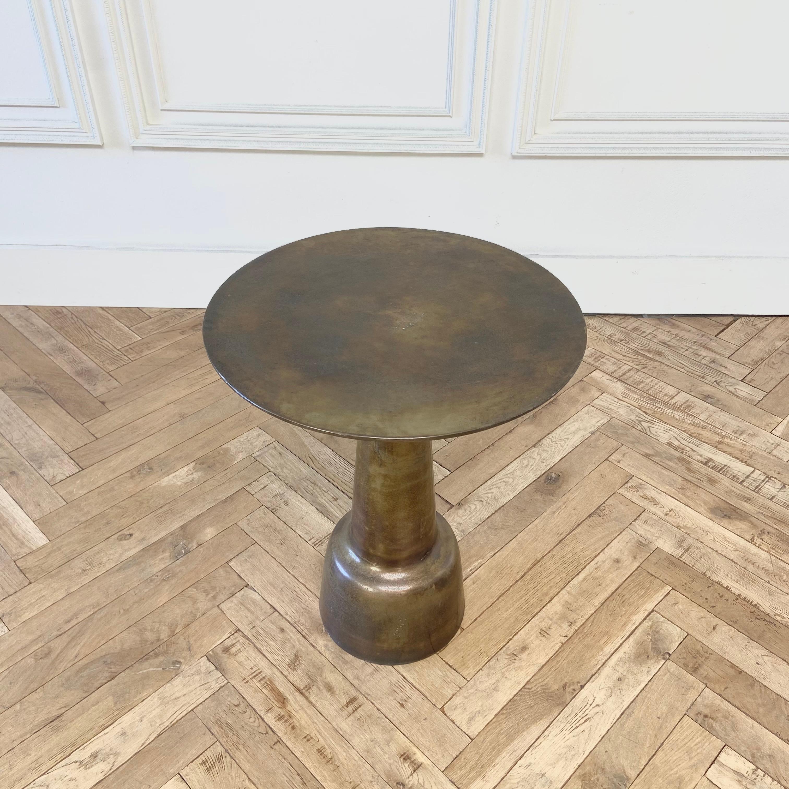 No table is exact, these beautiful side tables have an
Antique appeal, with its aged metal looking finish. The finish is bronze, pewter, and brass with aged pitted patina. Each one with its own unique finish.
Size:
21.5” Rd. x 26.25