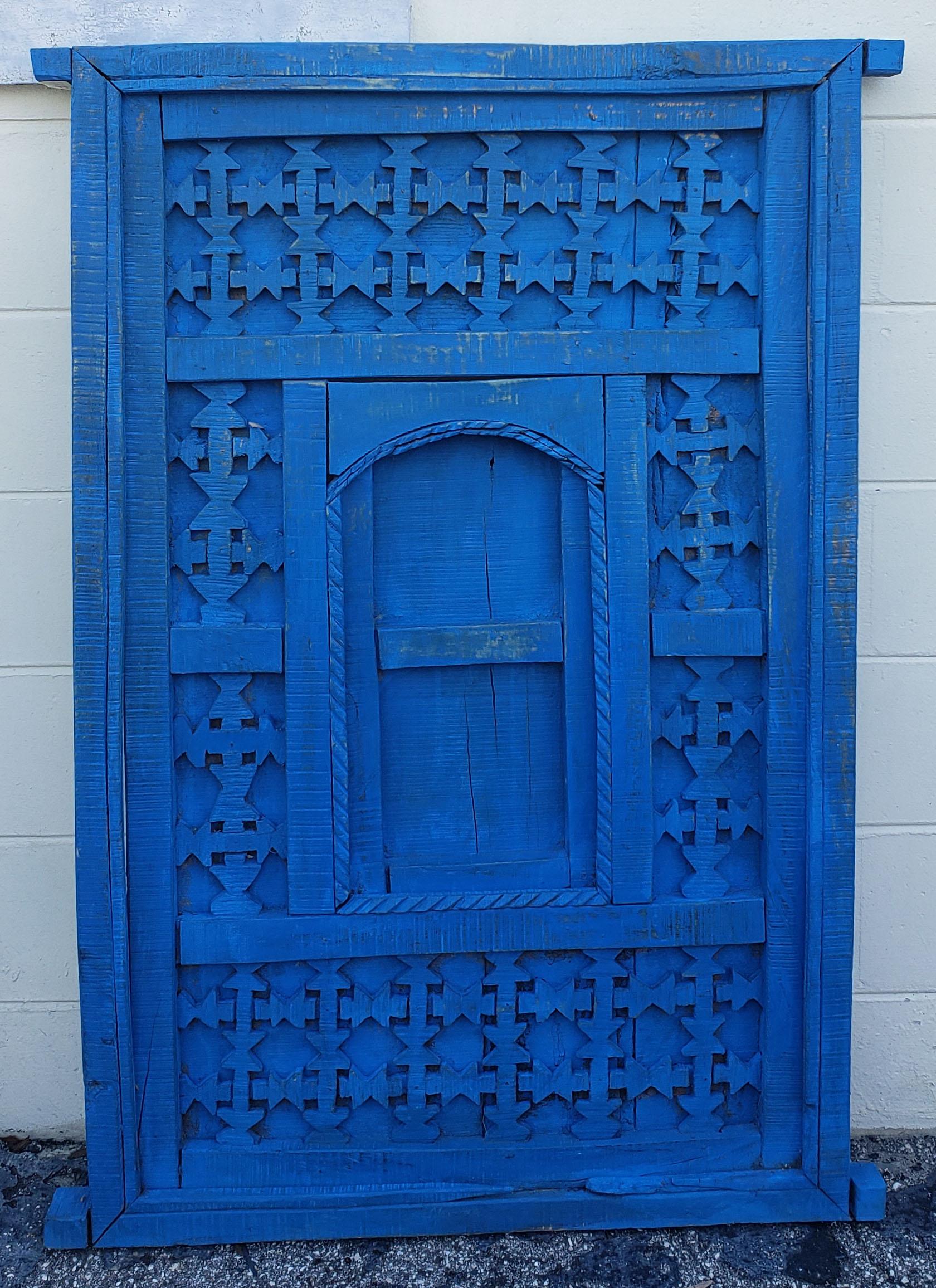 Very old and traditional Moroccan door, gate, or shutter. This door was taken from an old home in the Marrakech Medina when the house was being destroyed. Distressed in a blue color. Dimensions are approximately 51