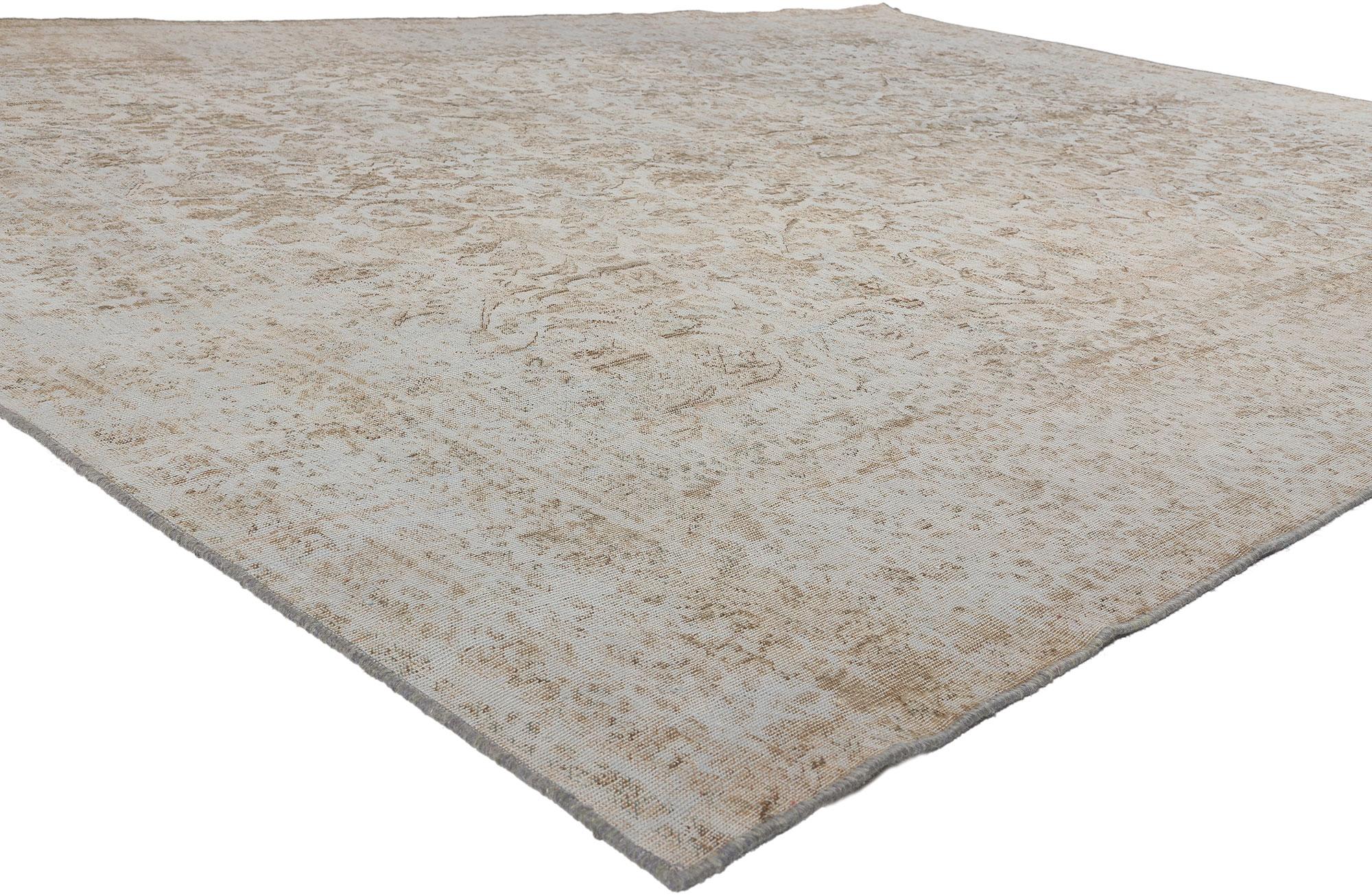 60770 Vintage Muted Turkish Rug, 09’05 x 12’07. In this hand-knotted wool distressed vintage Turkish rug, timeless elegance intertwines with quiet sophistication, resulting in a piece that exudes understated charm and refined allure. Its