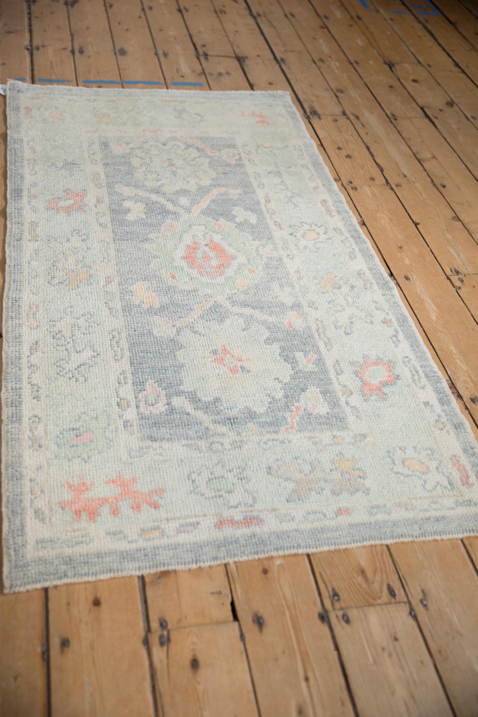 Hand-Knotted Distressed Oushak Rug For Sale
