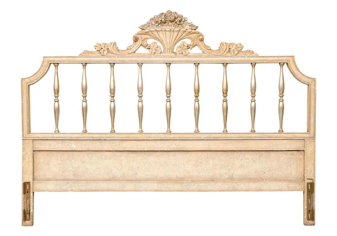 Vintage paint decorated king size headboard with a central fluted flowering urn. The urn flanked by scrolls and acanthus leaves across the cresting rail. The headboard with silver gilt spindles and cantered corners. Old hardware on each