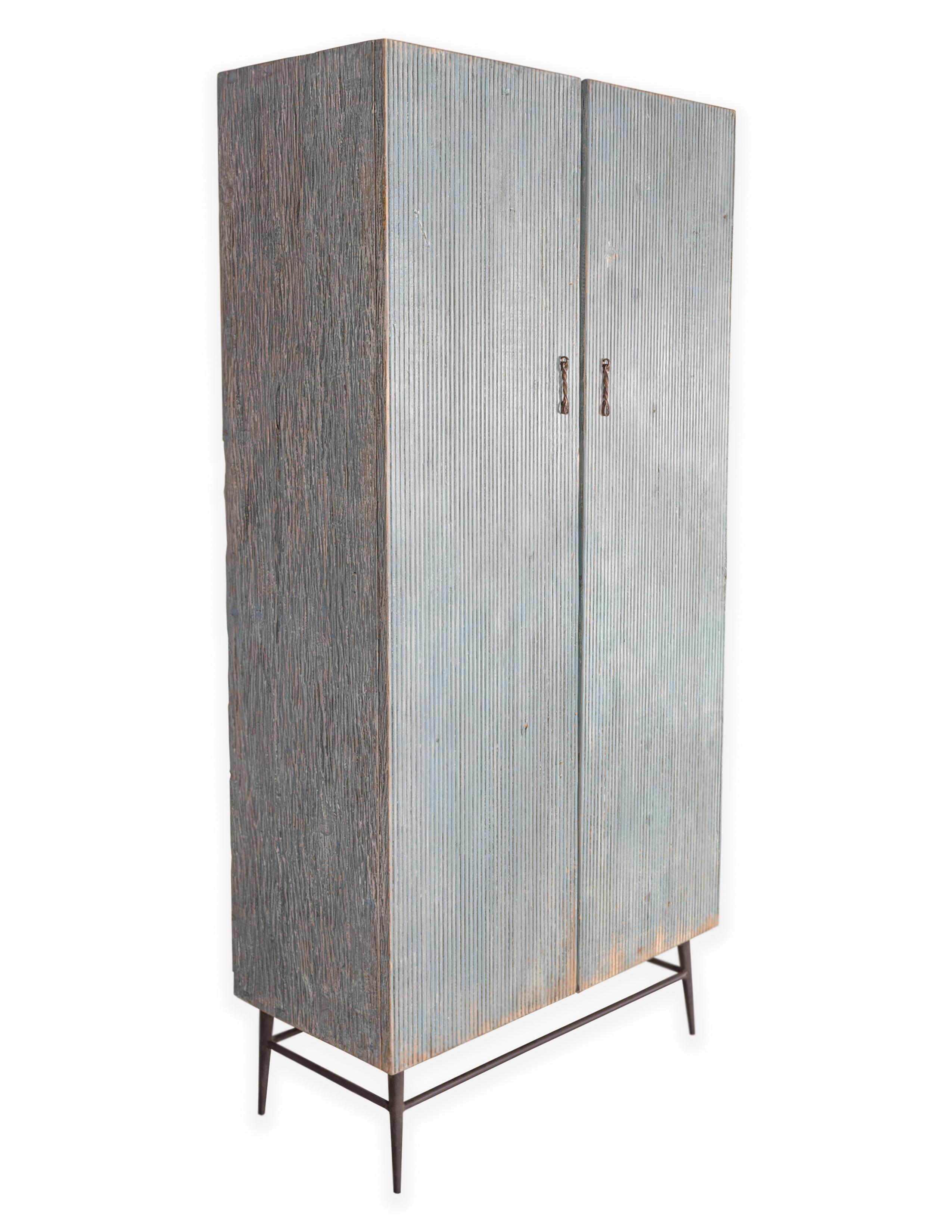 Distressed patina two door reeded wood cabinet.

In my organic, contemporary, vintage and mid-century modern aesthetic.

Piece from the Le Monde collection. Exclusive to Brendan Bass.
   