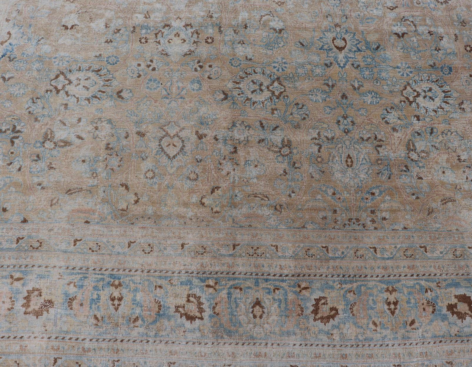 Distressed Persian Antique Mashhad Carpet with Muted Floral and Medallion Design For Sale 3