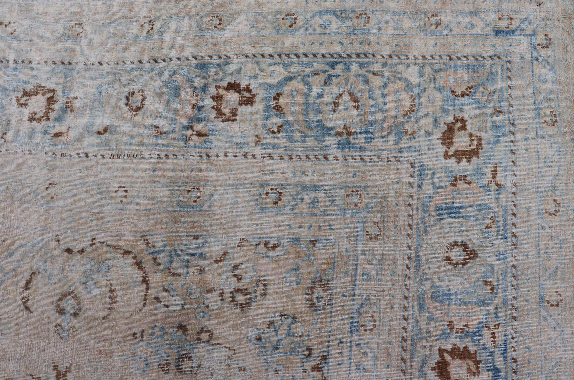 Hand-Knotted Distressed Persian Antique Mashhad Carpet with Muted Floral and Medallion Design For Sale